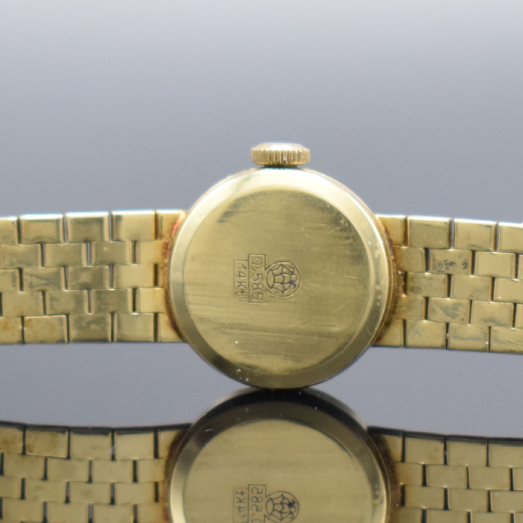 Detail b: MONTRIAL Damenarmbanduhr in GG 585/000, Schweiz um 1965, Handaufzug, 2-teil. Geh., Boden aufgedr., Goldband in GG 585/000, silb. Zifferbl. m. aufges. ...