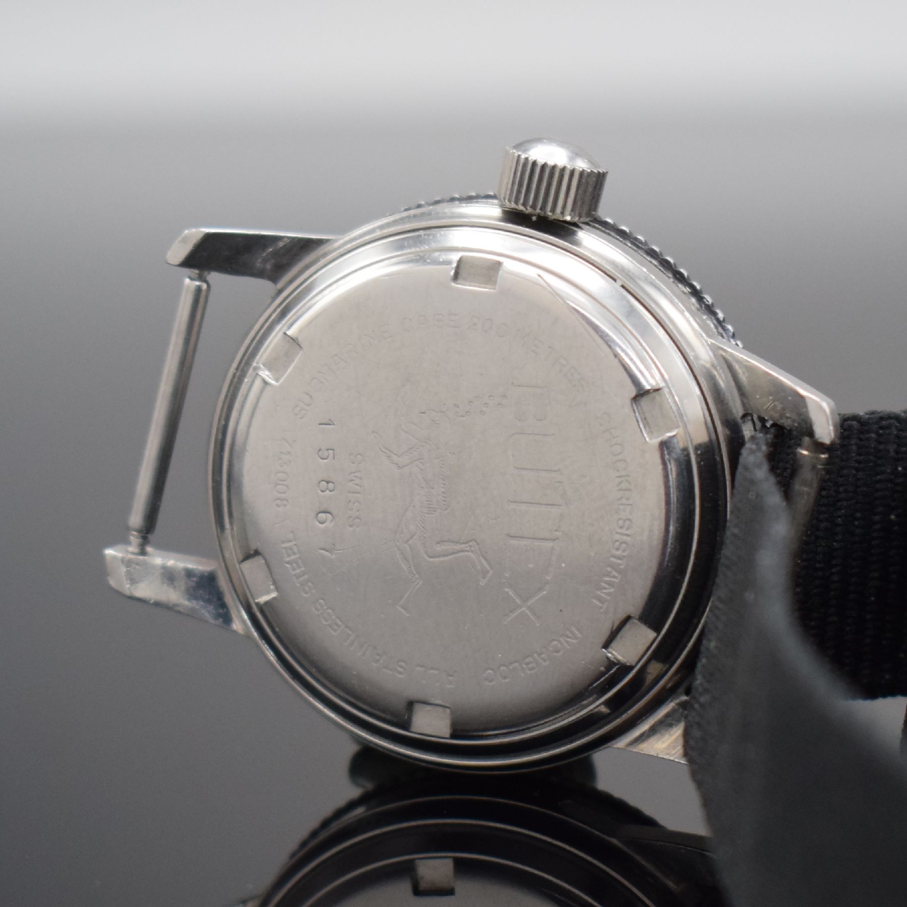 Detail e: BUTEX / BWC Armbanduhr im Taucherdesign in Stahl Referenz 713008, Schweiz um 1965, Automatik, Boden & Krone verschr., Lünette m. 60er Teilung beids. ...