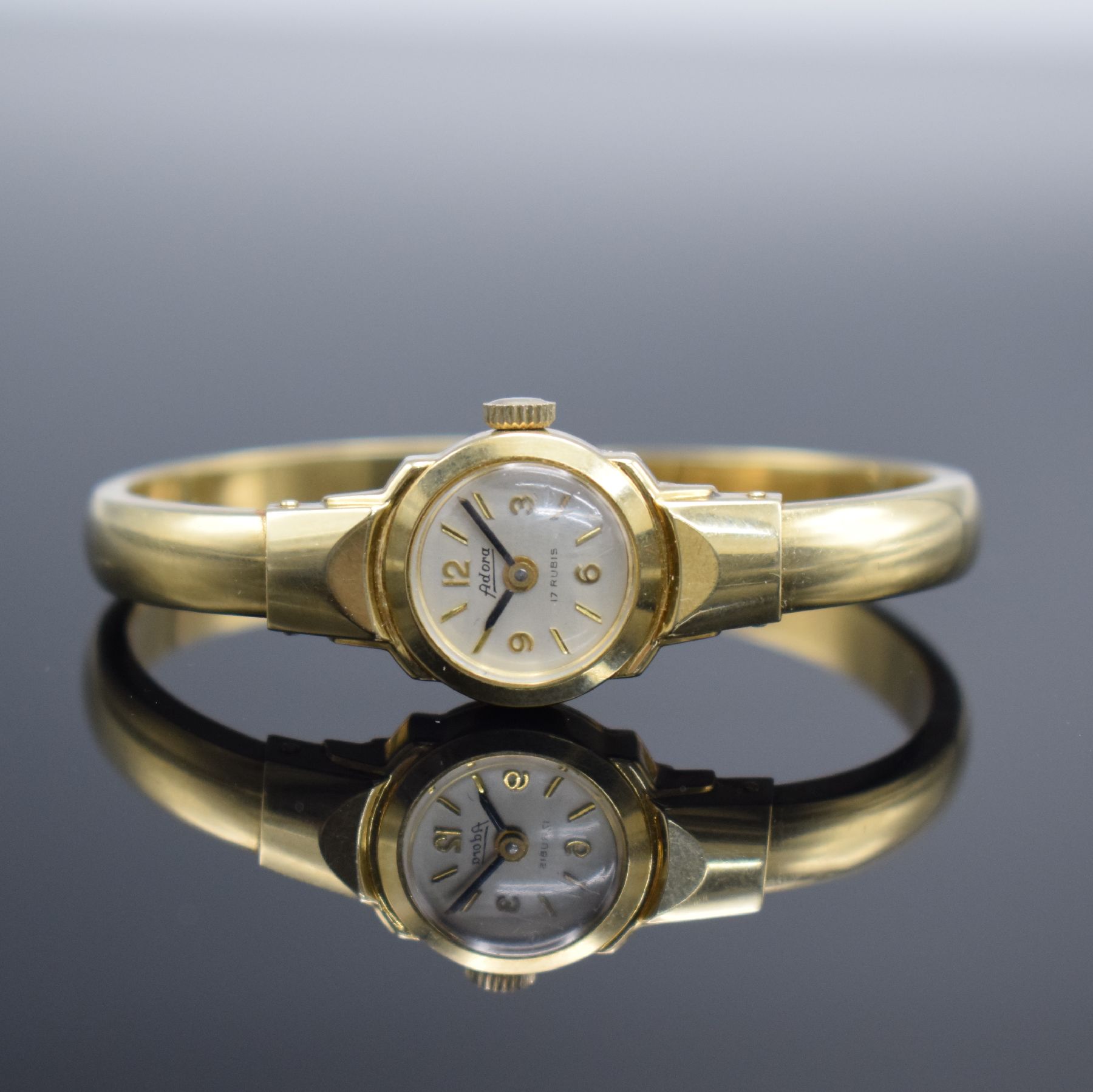 Damenspangenuhr signiert ADORA in GG 585/000, Schweiz um 1960, quarz, Boden aufgedr., Quarzwerk später auf Kundenwunsch, silb. Zifferbl. m. gold. ...