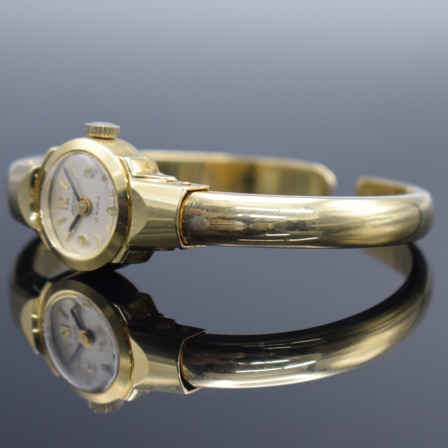 Detail d: Damenspangenuhr signiert ADORA in GG 585/000, Schweiz um 1960, quarz, Boden aufgedr., Quarzwerk später auf Kundenwunsch, silb. Zifferbl. m. gold. ...