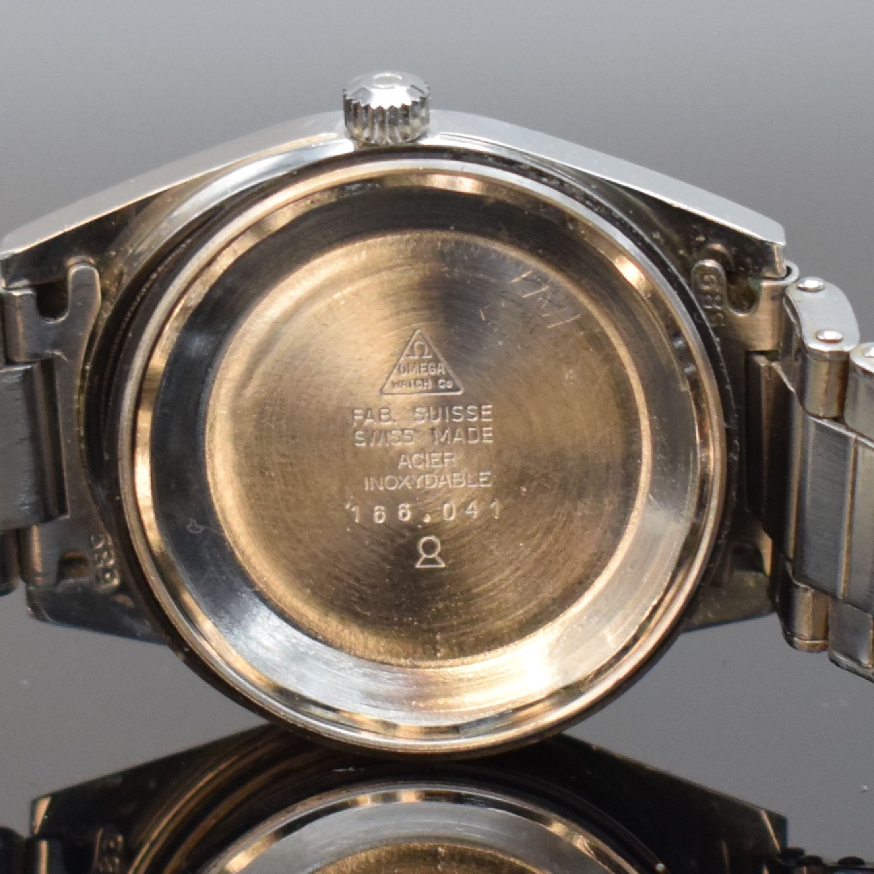 Detail i: OMEGA Geneve Herrenarmbanduhr Referenz 166.041, Automatik, Schweiz um 1968, Edelstahlgeh. inkl. orig. Gliederband m. Faltschl. Ref. 1156/G, Boden ...