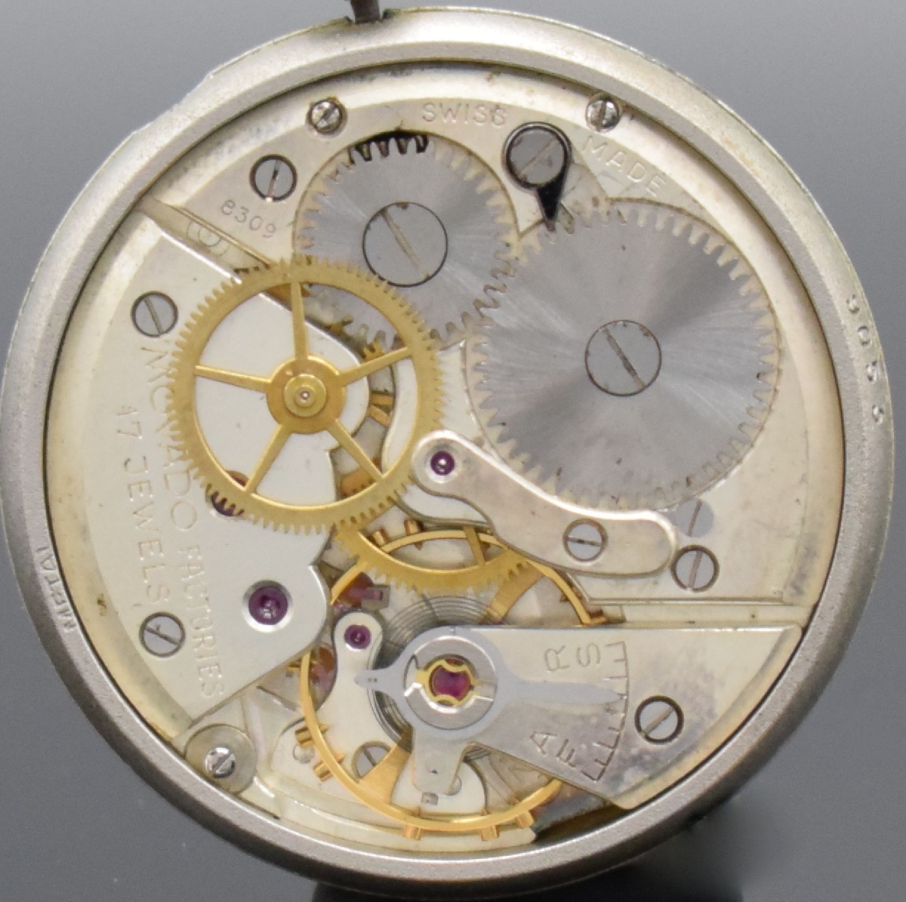 Detail g: MOVADO Herrenarmbanduhr in GG 750/000 mit Kaliber 127, Handaufzug um 1950, Handaufzug, 2-teil. Geh., Boden aufgedr., silb. Zifferbl. m. aufges. ...