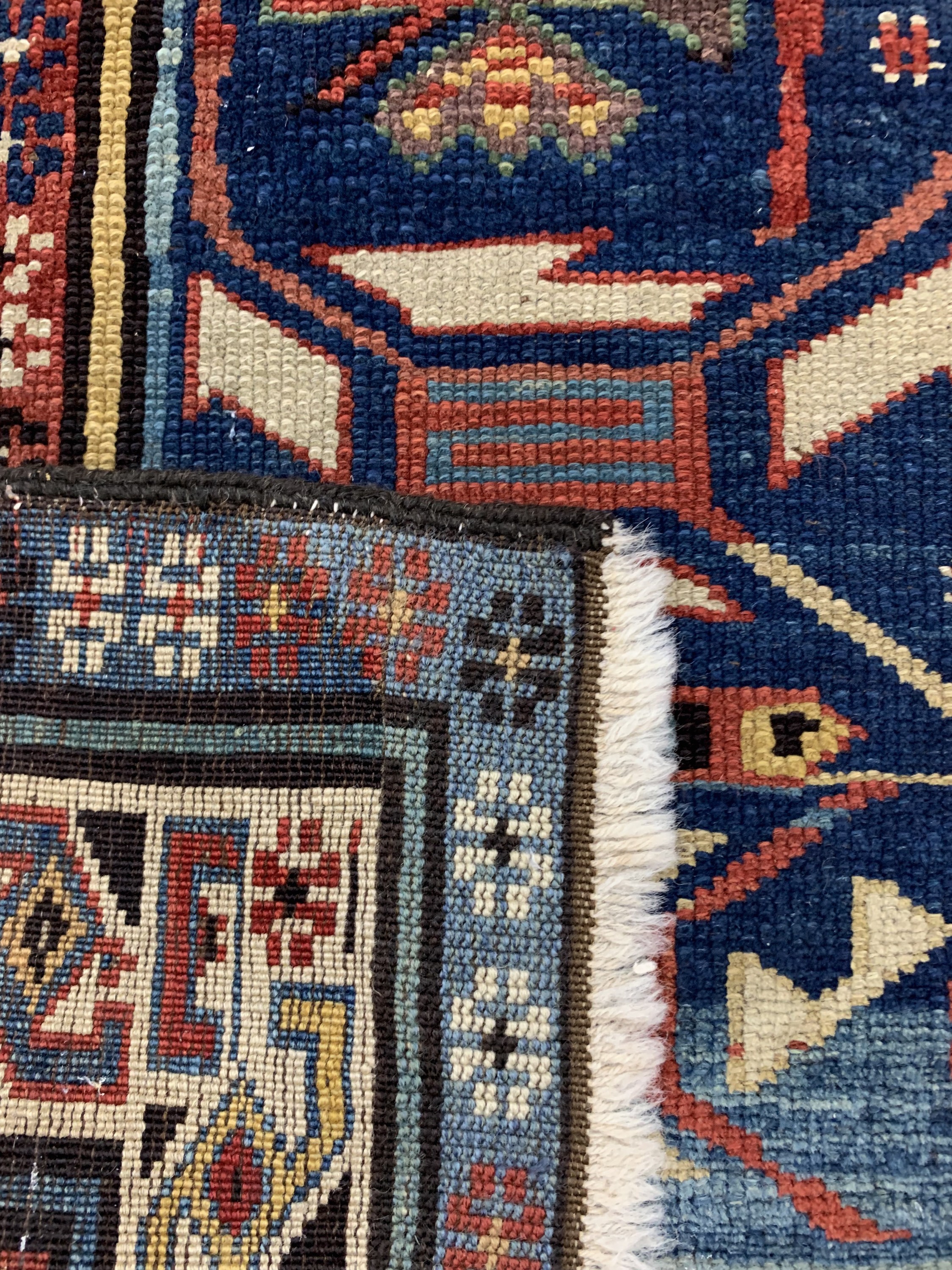 Detail g: Kuba-Schirwan antik, Kaukasus, um 1890, Wolle auf Wolle, ca. 272 x 126 cm, EHZ: 2-3(alte Restaurierungen).