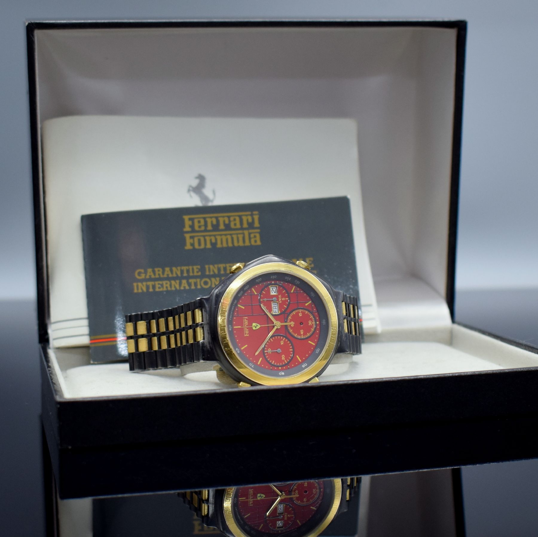 Detail h: FERRARI Formula Herrenchronograph in geschwärztem Stahl, Schweiz um 1990, quarz, Boden verschr., verg. Lünette m. Ferrari- Schriftzug, orig. ...