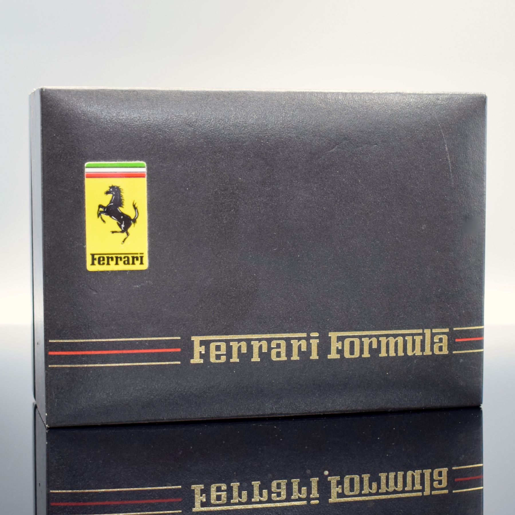 Detail i: FERRARI Formula Herrenchronograph in geschwärztem Stahl, Schweiz um 1990, quarz, Boden verschr., verg. Lünette m. Ferrari- Schriftzug, orig. ...