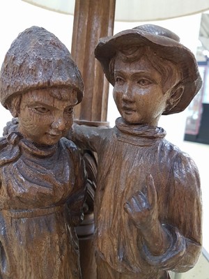 26344299a - Table lamp, German, around 1915, solid oak, couple of children, boy and girl, two lightingpoints, function and electrical not tested, H.approx. 80 cm