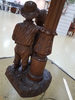 26344299c - Table lamp, German, around 1915, solid oak, couple of children, boy and girl, two lightingpoints, function and electrical not tested, H.approx. 80 cm