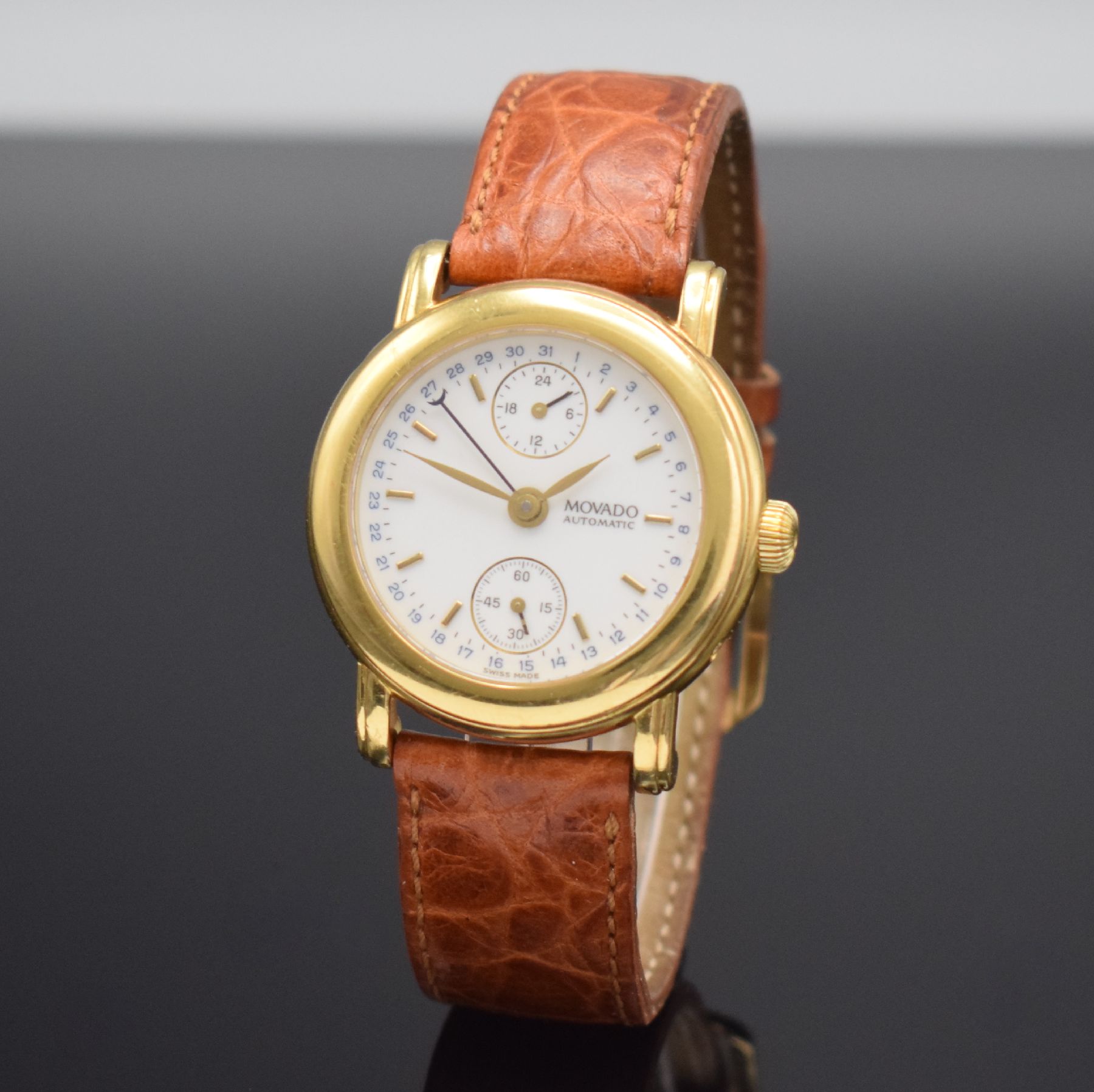 Detail b: MOVADO 1881 Herrenarmbanduhr in GG 750/000, Schweiz um 1995, Automatik, Ref. 40.B2.870, Boden 6-fach verschr. (1 Schr. zu ers.), orig. Lederband m. ...