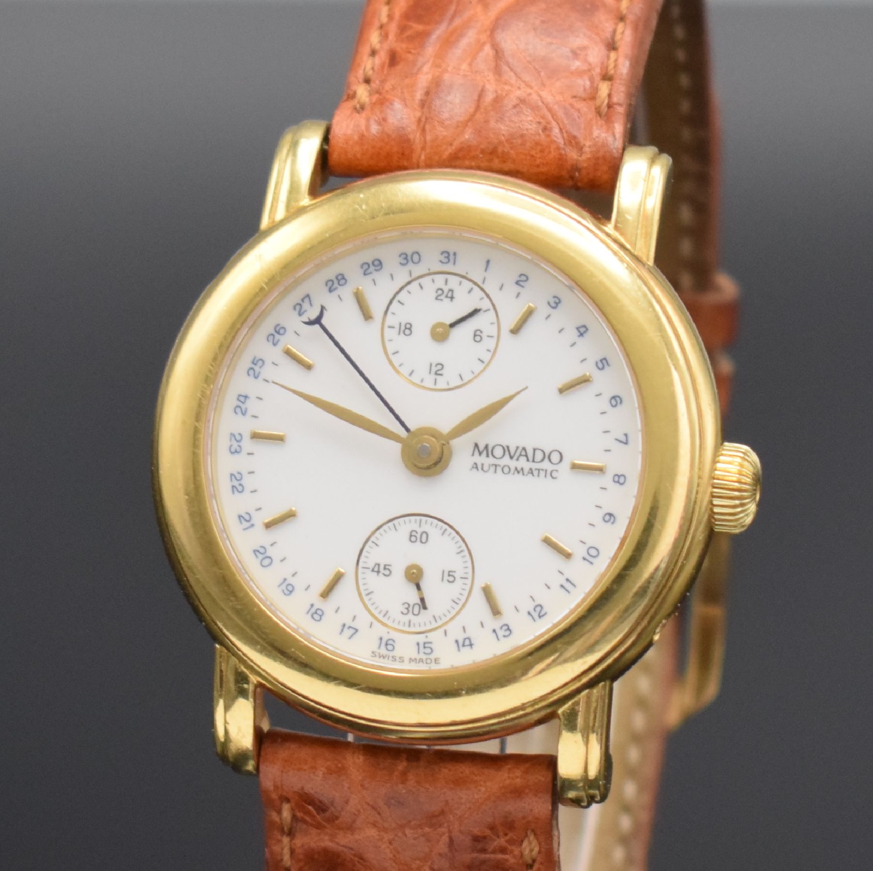 Detail c: MOVADO 1881 Herrenarmbanduhr in GG 750/000, Schweiz um 1995, Automatik, Ref. 40.B2.870, Boden 6-fach verschr. (1 Schr. zu ers.), orig. Lederband m. ...