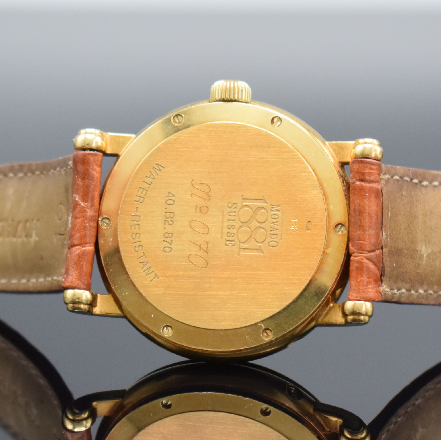 Detail f: MOVADO 1881 Herrenarmbanduhr in GG 750/000, Schweiz um 1995, Automatik, Ref. 40.B2.870, Boden 6-fach verschr. (1 Schr. zu ers.), orig. Lederband m. ...
