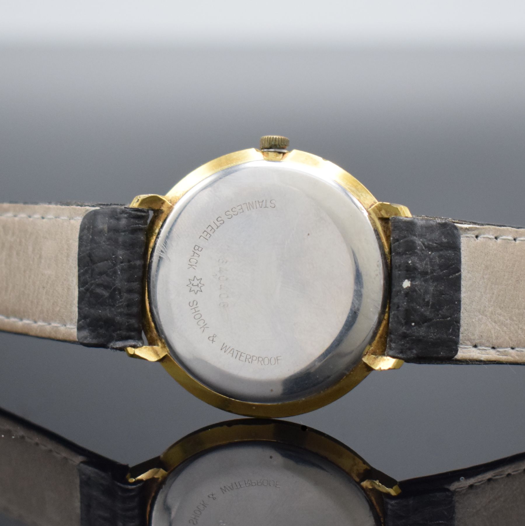 Detail e: JUNGHANS Chronometer vergoldete Herrenarmbanduhr Kaliber 85/10, Deutschland um 1955, Handaufzug, Stahlboden aufgedr., Krone neutr. ers., silb. ...