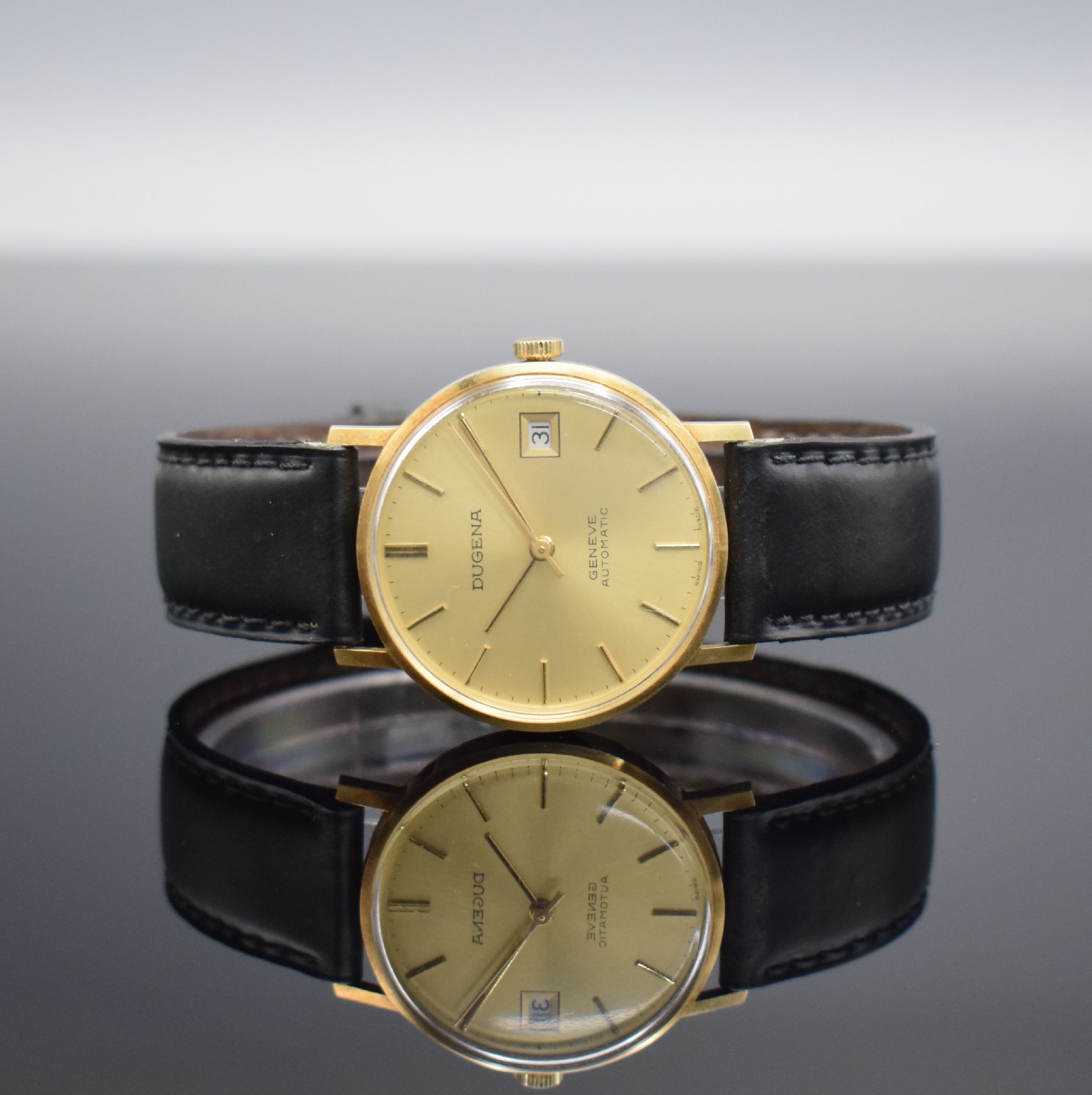 DUGENA Armbanduhr in GG 585/000, Schweiz um 1965, Automatik, Geh. angel., Boden m. Widmung aufgedr., gold. Zifferbl. m. aufgel. Std.- Ind., gold. ...