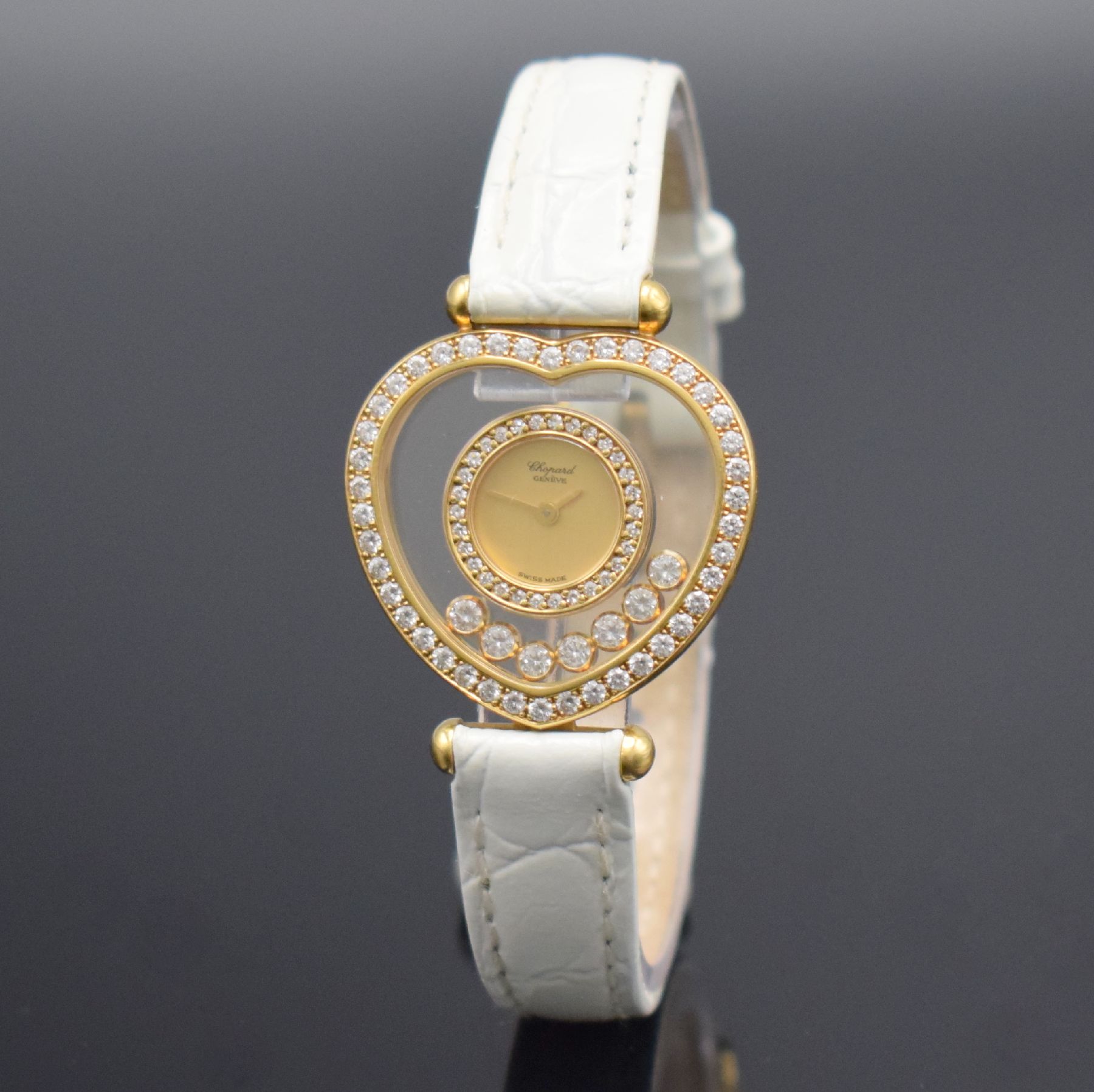 Detail b: CHOPARD Happy Diamonds Damenarmbanduhr in GG 750/000, Schweiz um 1995, herzförmiges Geh. beids. Saphirvergl., Lünette wie Außenbereich aufw. m. ...