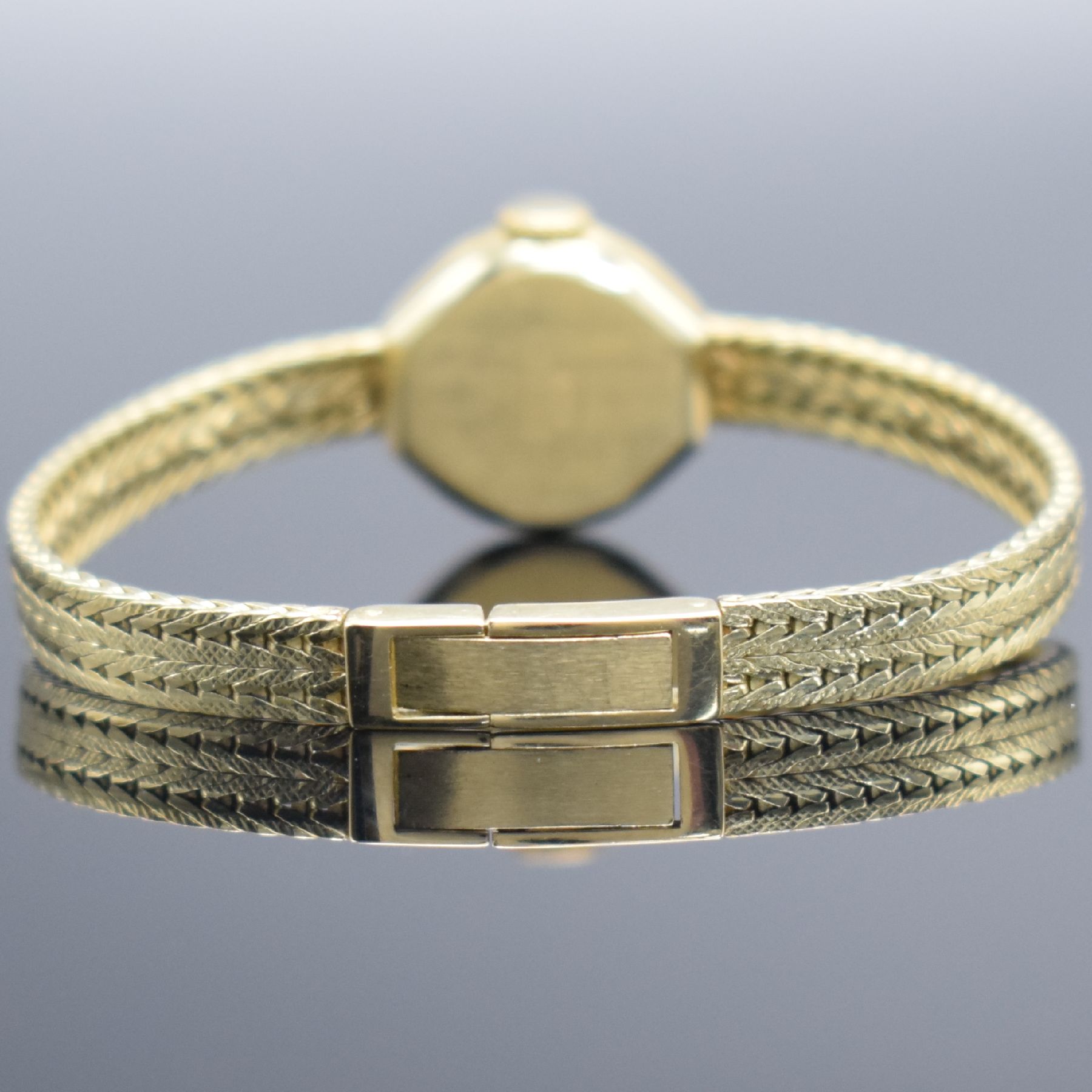 Detail c: LUTZ Damenarmbanduhr in GG 585/000, Schweiz um 1965, Handaufzug, Boden aufgedr., Goldband in 585/000, silb. Zifferbl. m. schwarzen Std.-Ind. & ...