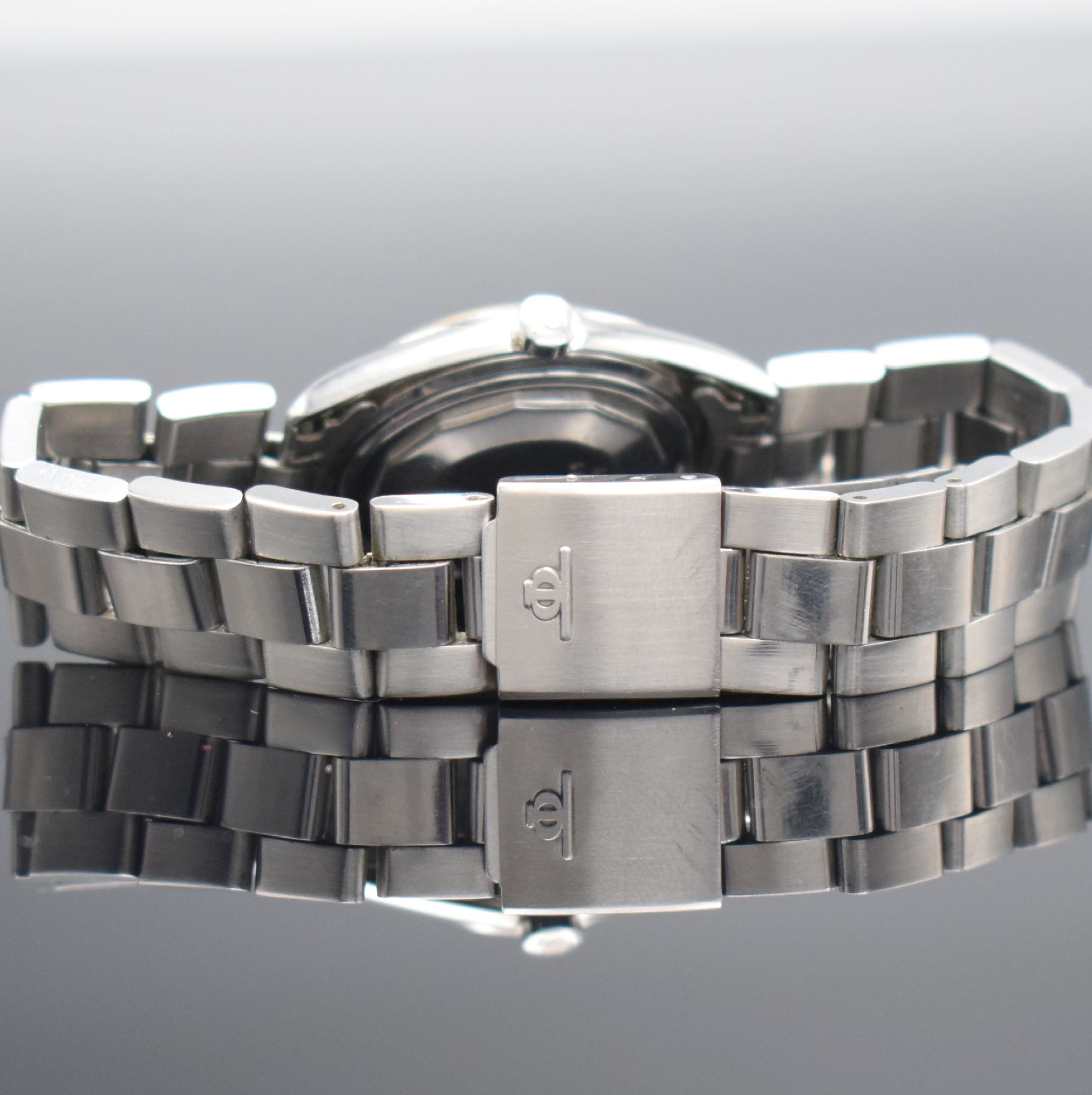 Detail e: BAUME & MERCIER Baumatic Armbanduhr Referenz 1187 in Stahl Schweiz um 1970, Automatik, 2-teil. Geh., Boden geschr., orig. Gliederband m. Faltschl., ...
