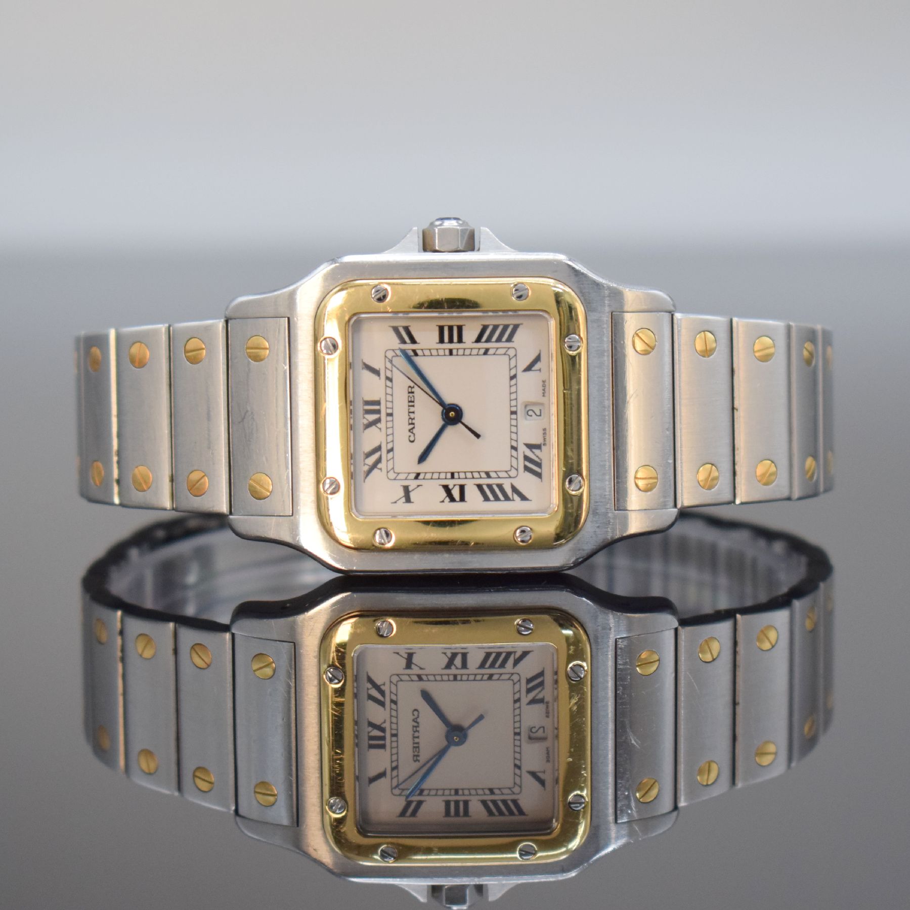 CARTIER Santos Herrenarmbanduhr, Schweiz um 1991, quarz, Edelstahl & Gold komb. inkl. Gliederband m. Faltschl., Goldlünette, Boden 8-fach verschr., ...