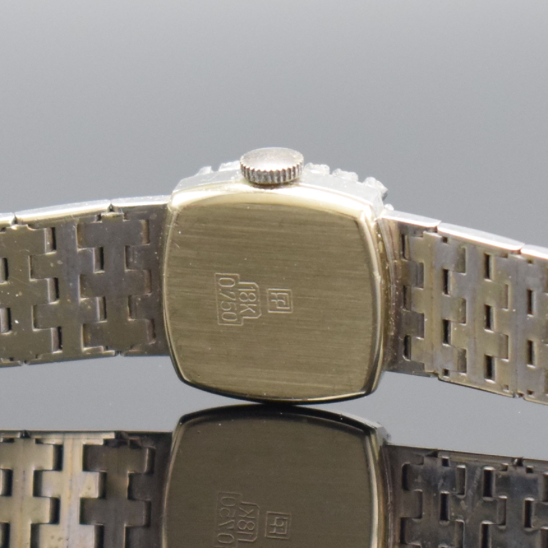 Detail c: CANDINO Damenarmbanduhr mit Diamantbesatz in WG 750/000, Schweiz um 1970, Handaufzug, Boden aufgedr., Geh. an Goldband 750/000, silb. Zifferbl. m. ...