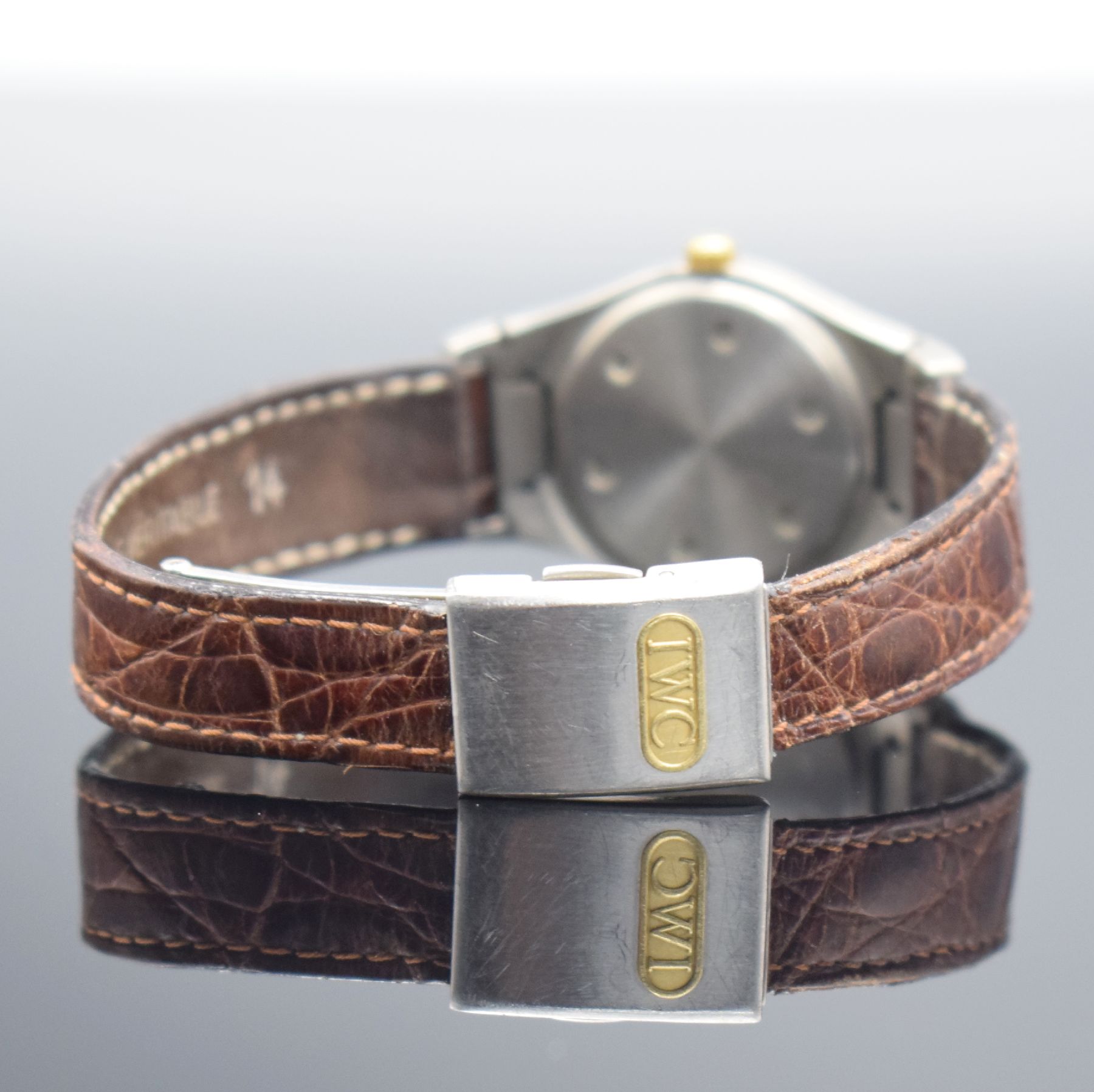 Detail d: IWC Damenarmbanduhr Serie Ingenieur Referenz 4560, Schweiz um 1990, Titan/Gold kombiniert inkl. Lederband m. orig. Faltschl., Boden verschr., ...