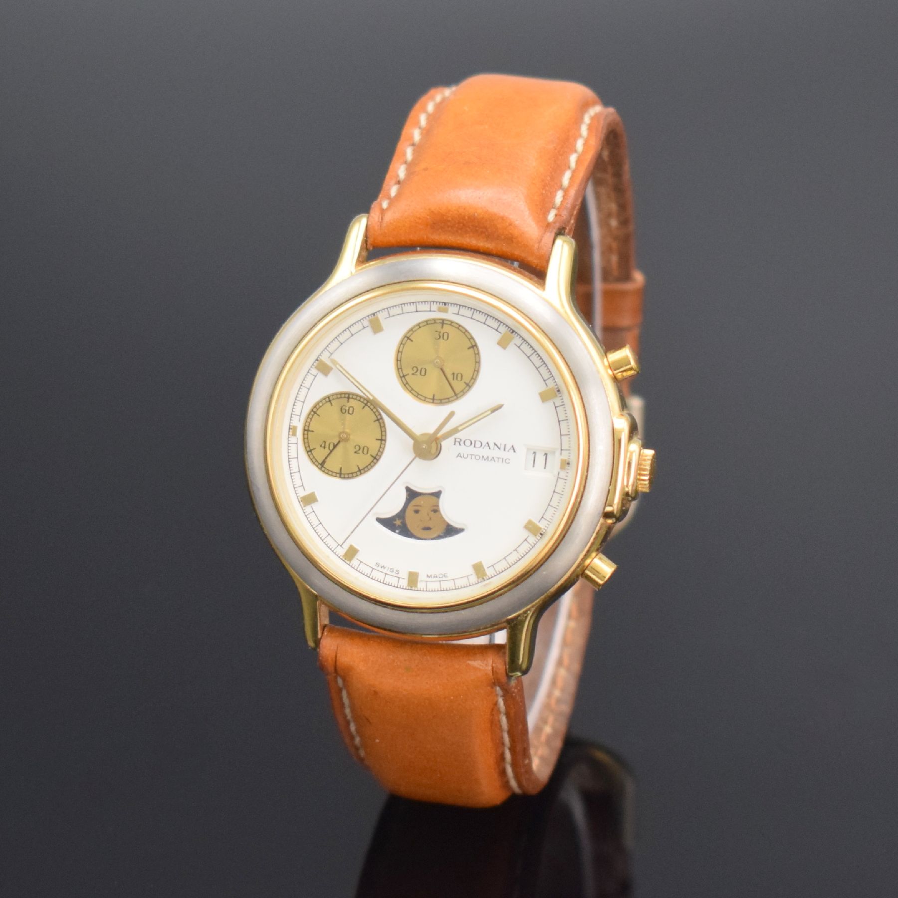 Detail b: RODANIA Herrenarmbanduhr mit Chronograph & Mondphase, Schweiz um 1985, Automatik, verg. Geh., Boden aufgedr., weißes Zifferbl. m. gold. Ind. & ...