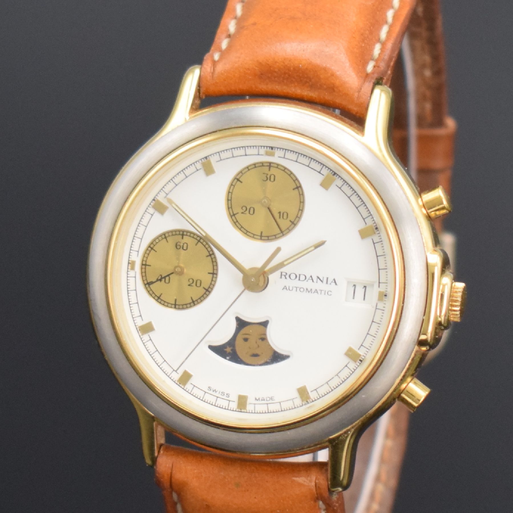 Detail c: RODANIA Herrenarmbanduhr mit Chronograph & Mondphase, Schweiz um 1985, Automatik, verg. Geh., Boden aufgedr., weißes Zifferbl. m. gold. Ind. & ...