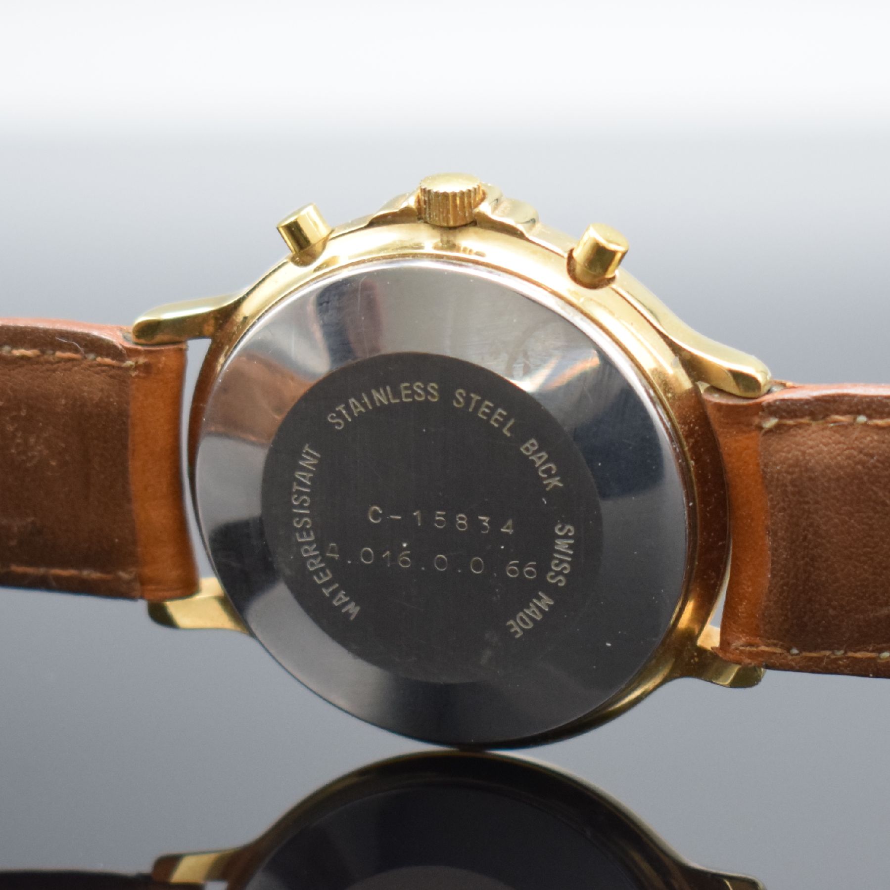 Detail d: RODANIA Herrenarmbanduhr mit Chronograph & Mondphase, Schweiz um 1985, Automatik, verg. Geh., Boden aufgedr., weißes Zifferbl. m. gold. Ind. & ...