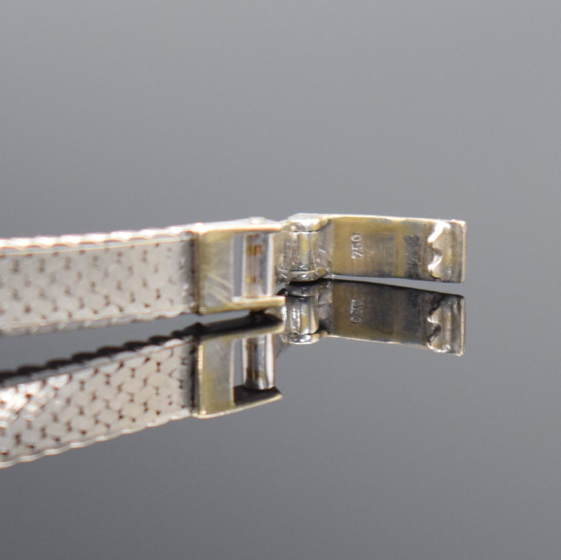Detail b: METEOR Damenarmbanduhr in WG 750/000, Handaufzug, Schweiz um 1965, Boden aufgedr., Lünette m. Steinbesatz, silb. Zifferbl. m. aufgel. Indizes ...