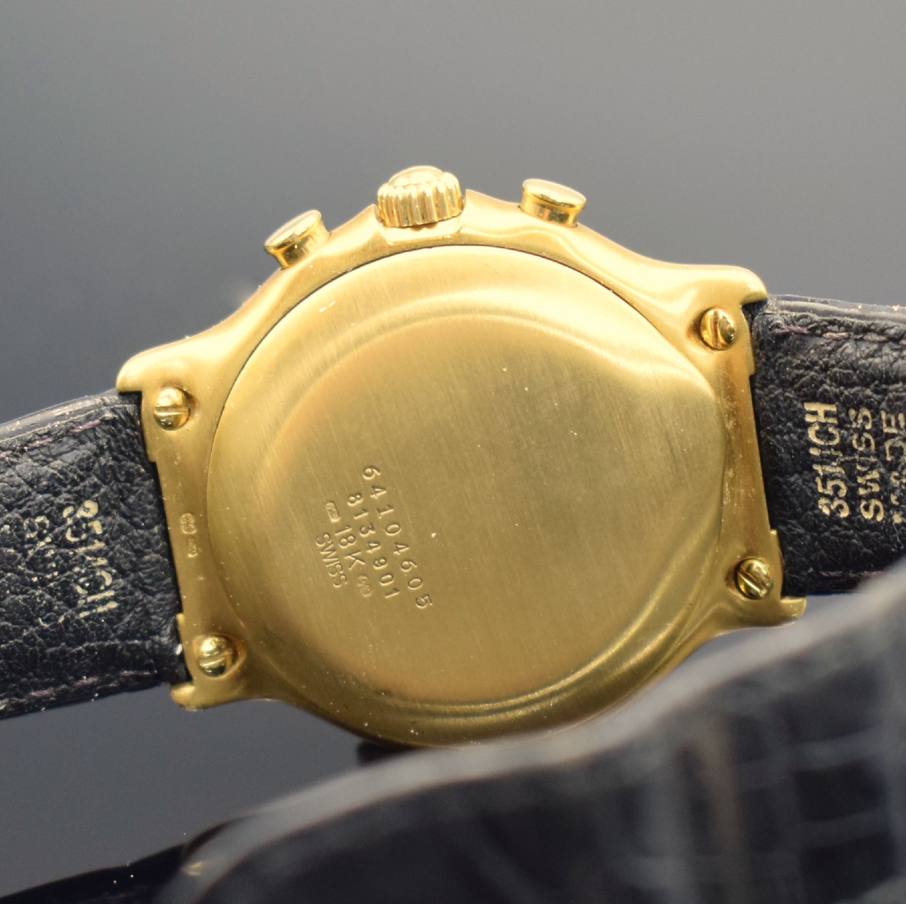 Detail e: EBEL El Primero Schaltradchronograph in GG 750/000, Schweiz um 1995, Automatik, Ref. 8134901, Boden aufgedr., neutr. Lederband m. orig. Faltschl. in ...