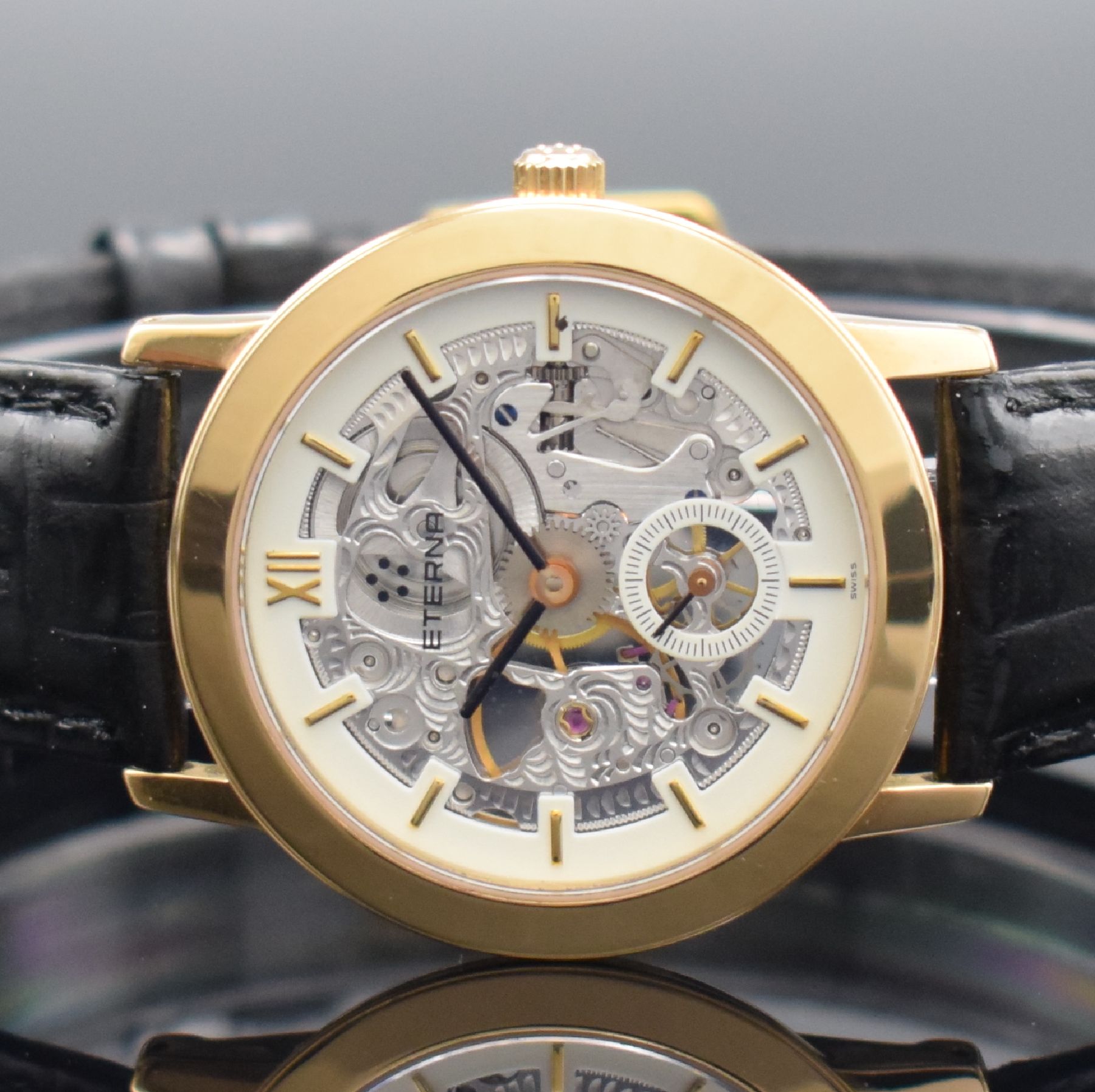 Detail a: ETERNA skelettierte Armbanduhr in GG 750/000, Schweiz um 1990, Handaufzug, in limitierter Auflage, Ref. 1856, beids. vergl. Geh., Boden aufgedr., ...