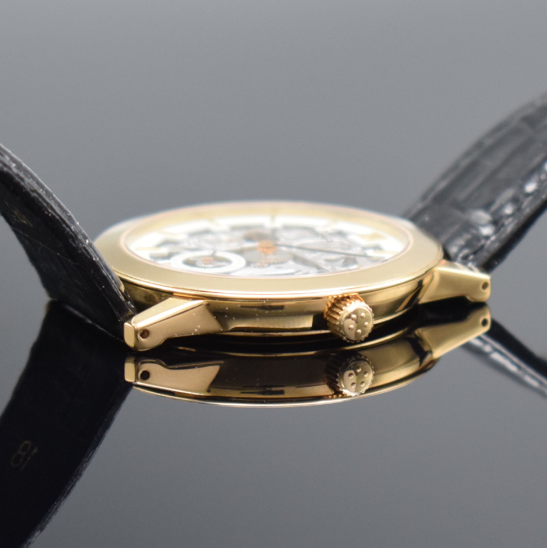 Detail e: ETERNA skelettierte Armbanduhr in GG 750/000, Schweiz um 1990, Handaufzug, in limitierter Auflage, Ref. 1856, beids. vergl. Geh., Boden aufgedr., ...