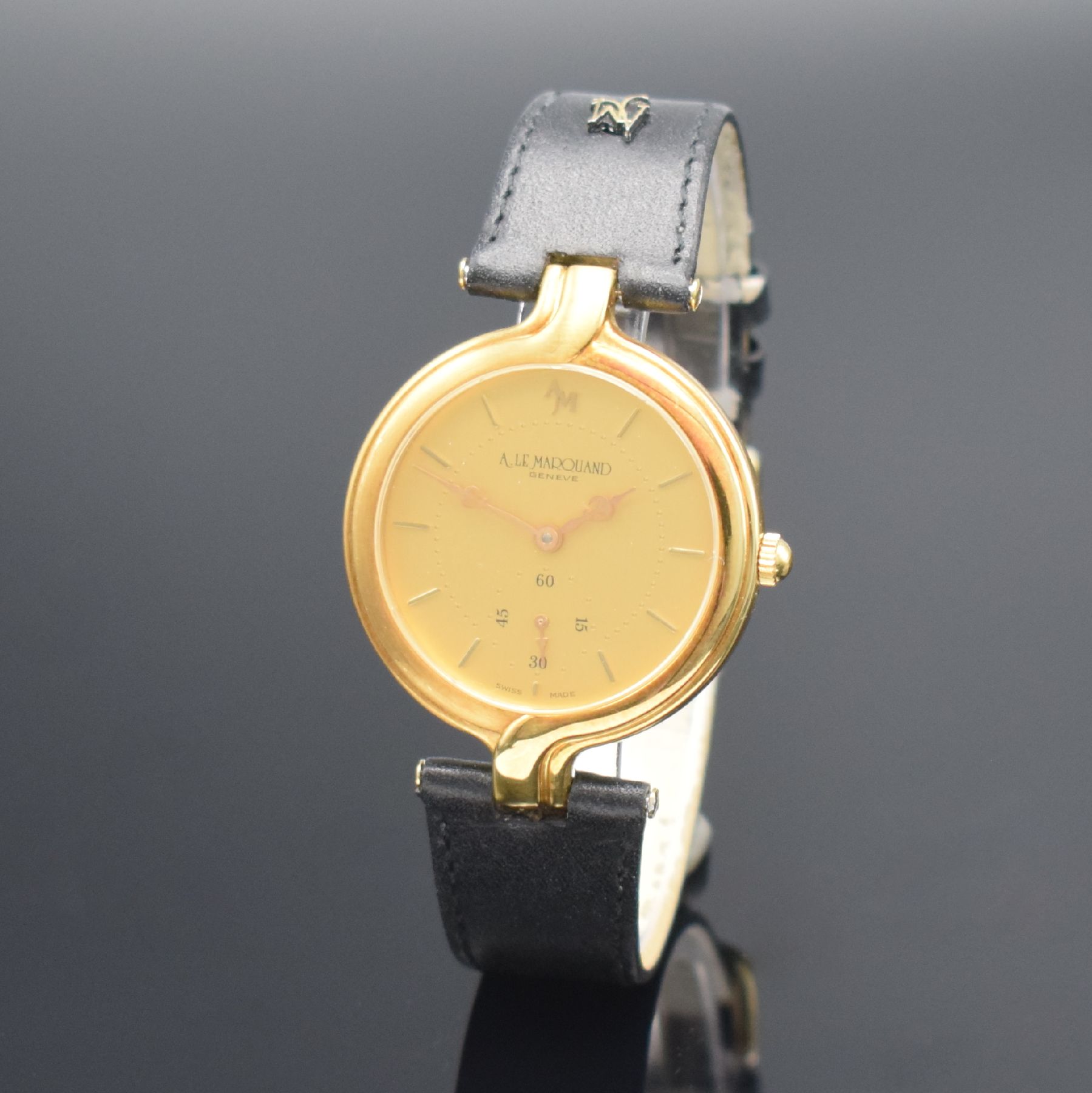 Detail b: ANDRE LE MARQUAND Armbanduhr in GG 750/000, Schweiz um 1990, Handaufzug, Boden aufgedr., orig. Lederband m. verg. Dornschl., gold. Zifferbl. m. gold. ...