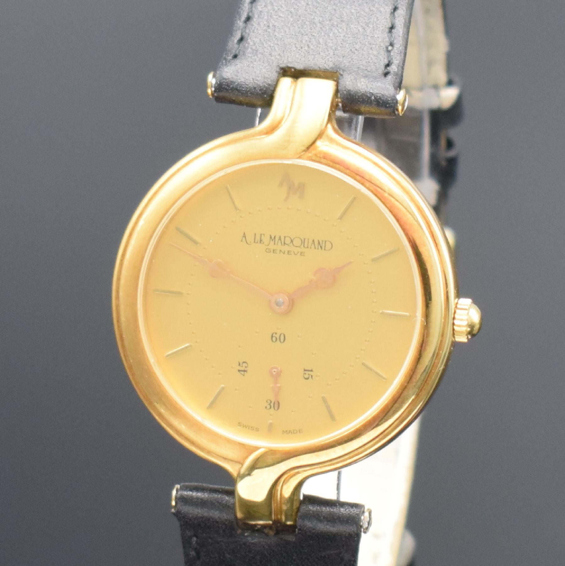 Detail c: ANDRE LE MARQUAND Armbanduhr in GG 750/000, Schweiz um 1990, Handaufzug, Boden aufgedr., orig. Lederband m. verg. Dornschl., gold. Zifferbl. m. gold. ...