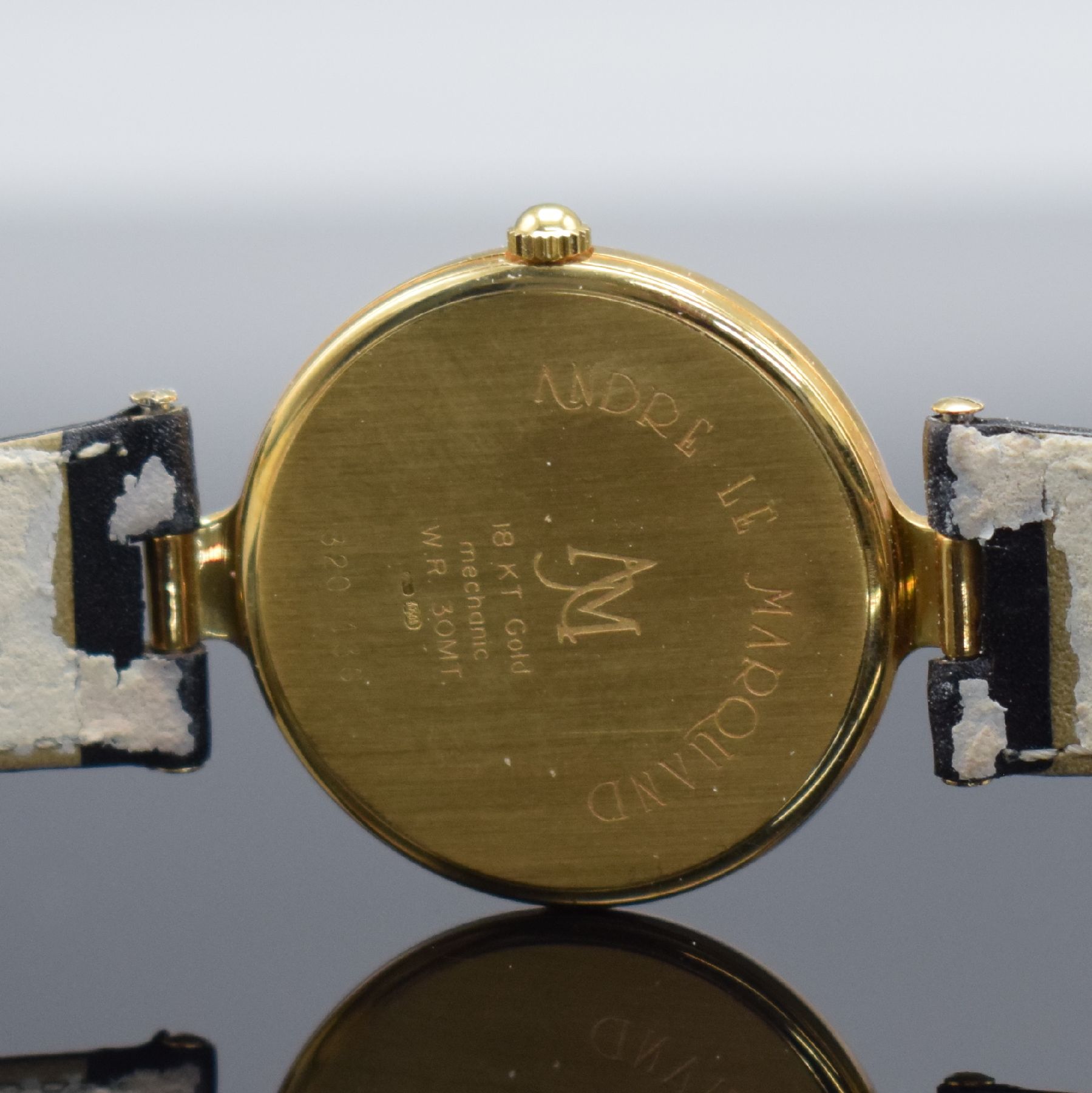Detail e: ANDRE LE MARQUAND Armbanduhr in GG 750/000, Schweiz um 1990, Handaufzug, Boden aufgedr., orig. Lederband m. verg. Dornschl., gold. Zifferbl. m. gold. ...