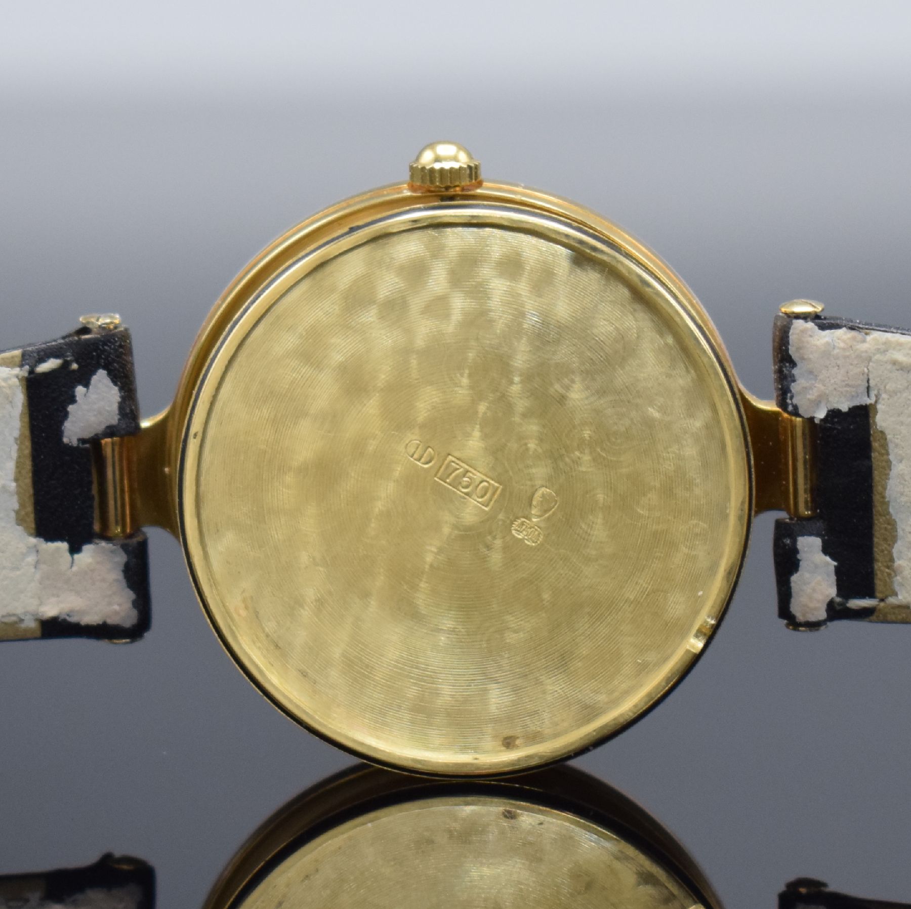 Detail g: ANDRE LE MARQUAND Armbanduhr in GG 750/000, Schweiz um 1990, Handaufzug, Boden aufgedr., orig. Lederband m. verg. Dornschl., gold. Zifferbl. m. gold. ...