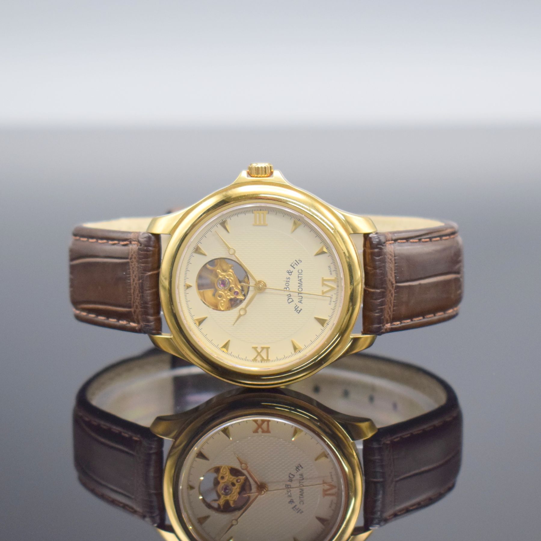 PH. DU BOIS & FILS Herrenarmbanduhr in GG 750/000, Schweiz um 2005, Automatik, beids. vergl. Geh., Boden aufgedr., orig. Lederband m. neutr. verg. ...