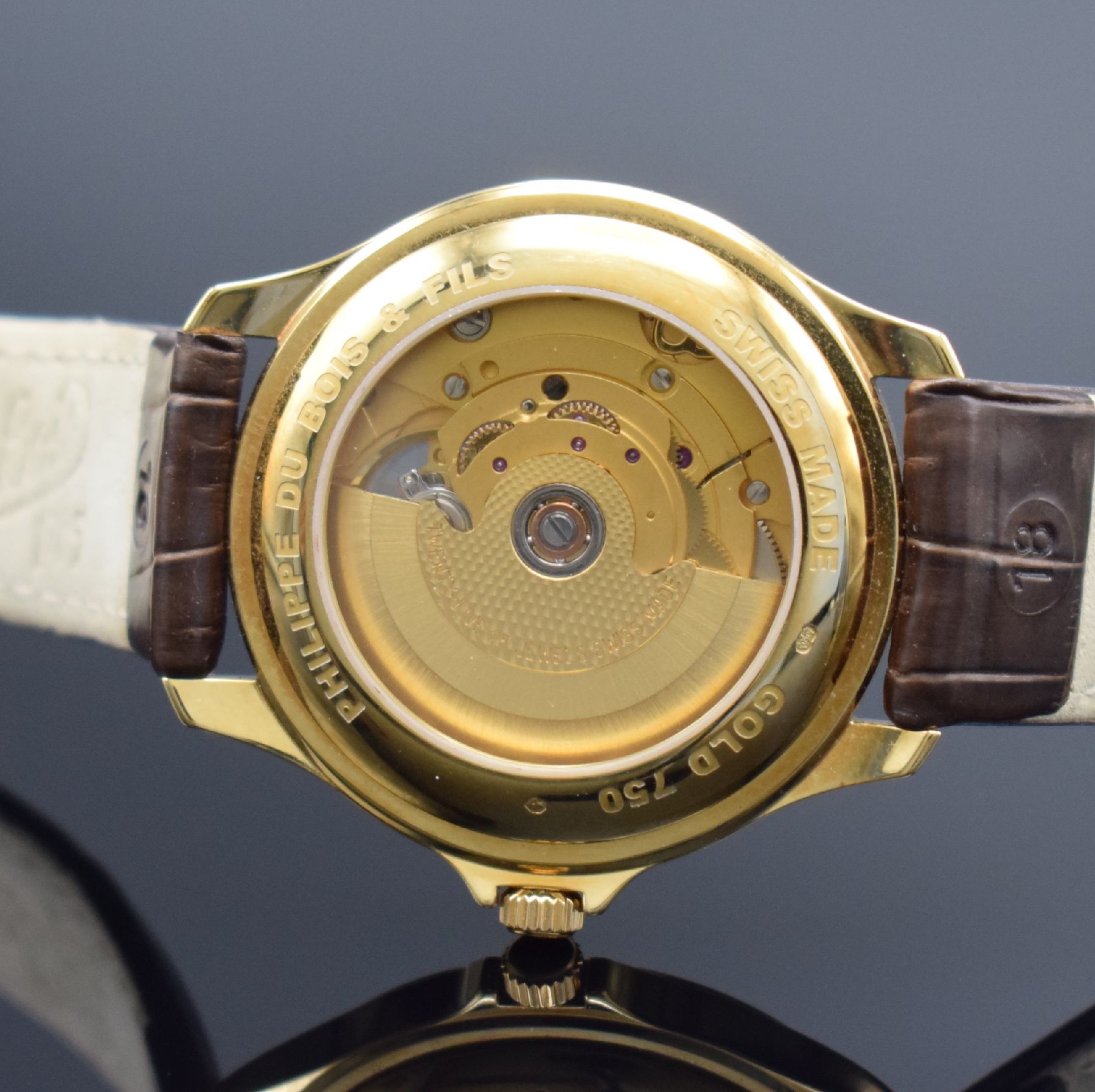 Detail e: PH. DU BOIS & FILS Herrenarmbanduhr in GG 750/000, Schweiz um 2005, Automatik, beids. vergl. Geh., Boden aufgedr., orig. Lederband m. neutr. verg. ...