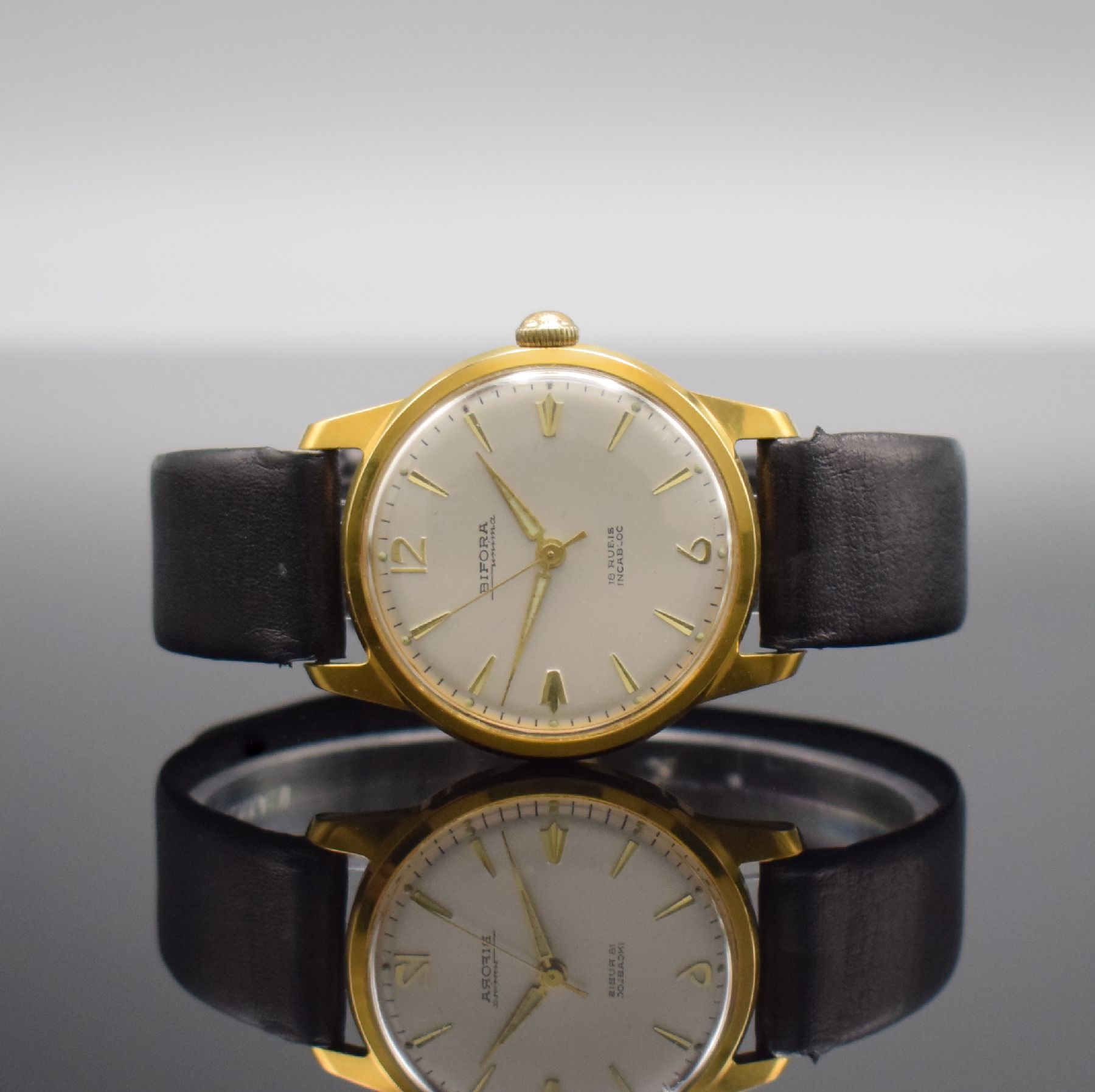 BIFORA unima Kaliber 120 seltene Armbanduhr, Deutschland um 1955, Handaufzug, verg. Geh. m. verschr. Stahlboden, silb. Zifferbl., gold. Indizes & ...