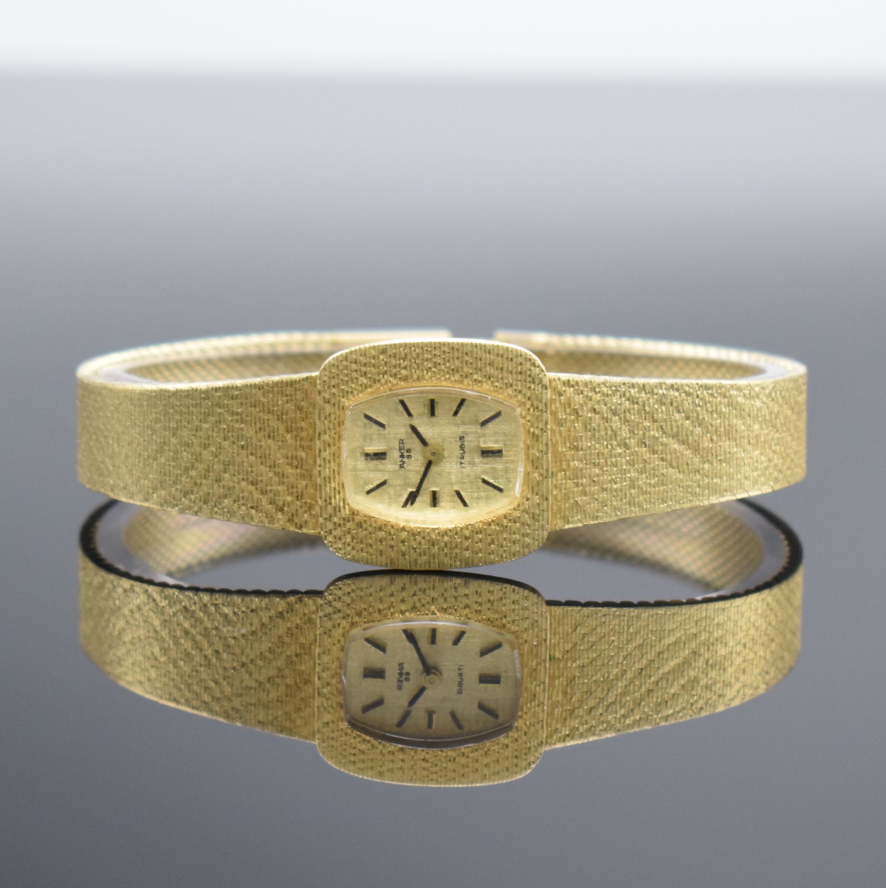 ANKER 85 Damenarmbanduhr in GG 585/000, Handaufzug, Schweiz um 1970, Boden aufgedr., gold. Strukturzifferbl. m. aufgel. Indizes, Anz. v. Std. & Min., ...