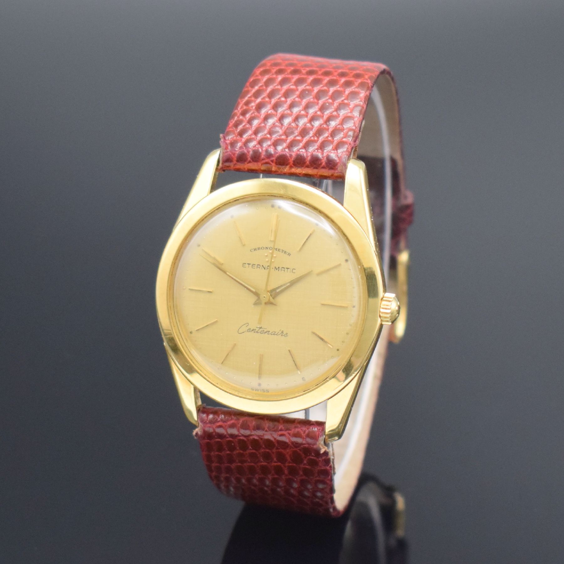 Detail b: ETERNA-MATIC Centenaire Chronometer Herrenarmbanduhr in GG 750/000, Schweiz um 1965, Automatik, 3-teil. Geh., Boden geschr., Glasrand aufgedr., gold. ...