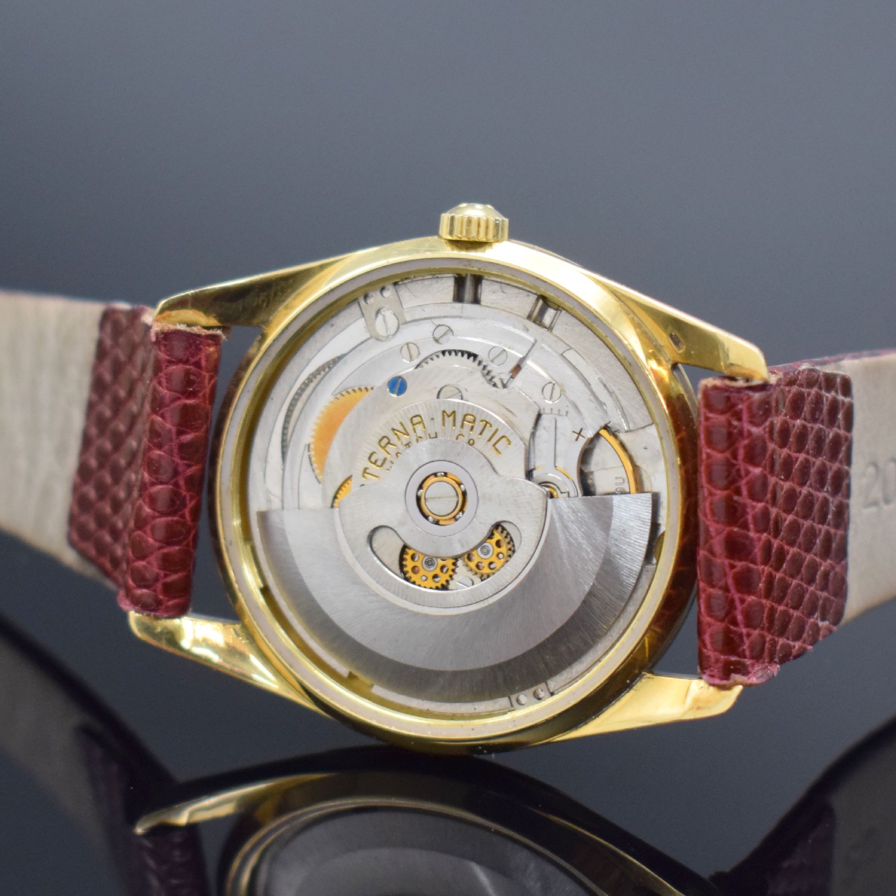 Detail f: ETERNA-MATIC Centenaire Chronometer Herrenarmbanduhr in GG 750/000, Schweiz um 1965, Automatik, 3-teil. Geh., Boden geschr., Glasrand aufgedr., gold. ...