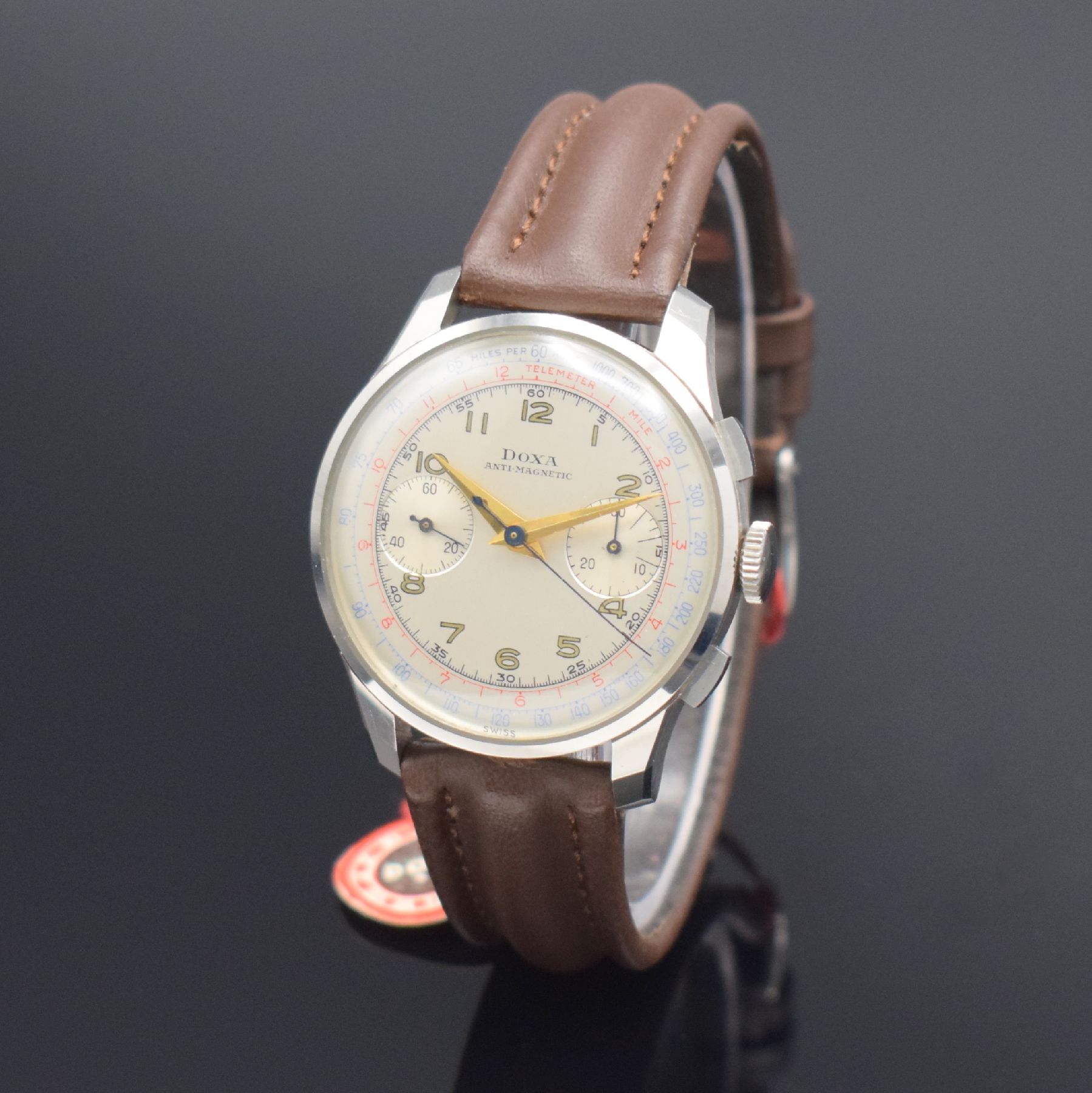 Detail b: DOXA nahezu neuwertige Herrenarmbanduhr mit Schaltradchronograph in Stahl, Schweiz um 1950, Handaufzug, gedr. 3-tlg. Geh. noch mit Schutzlack auf dem ...