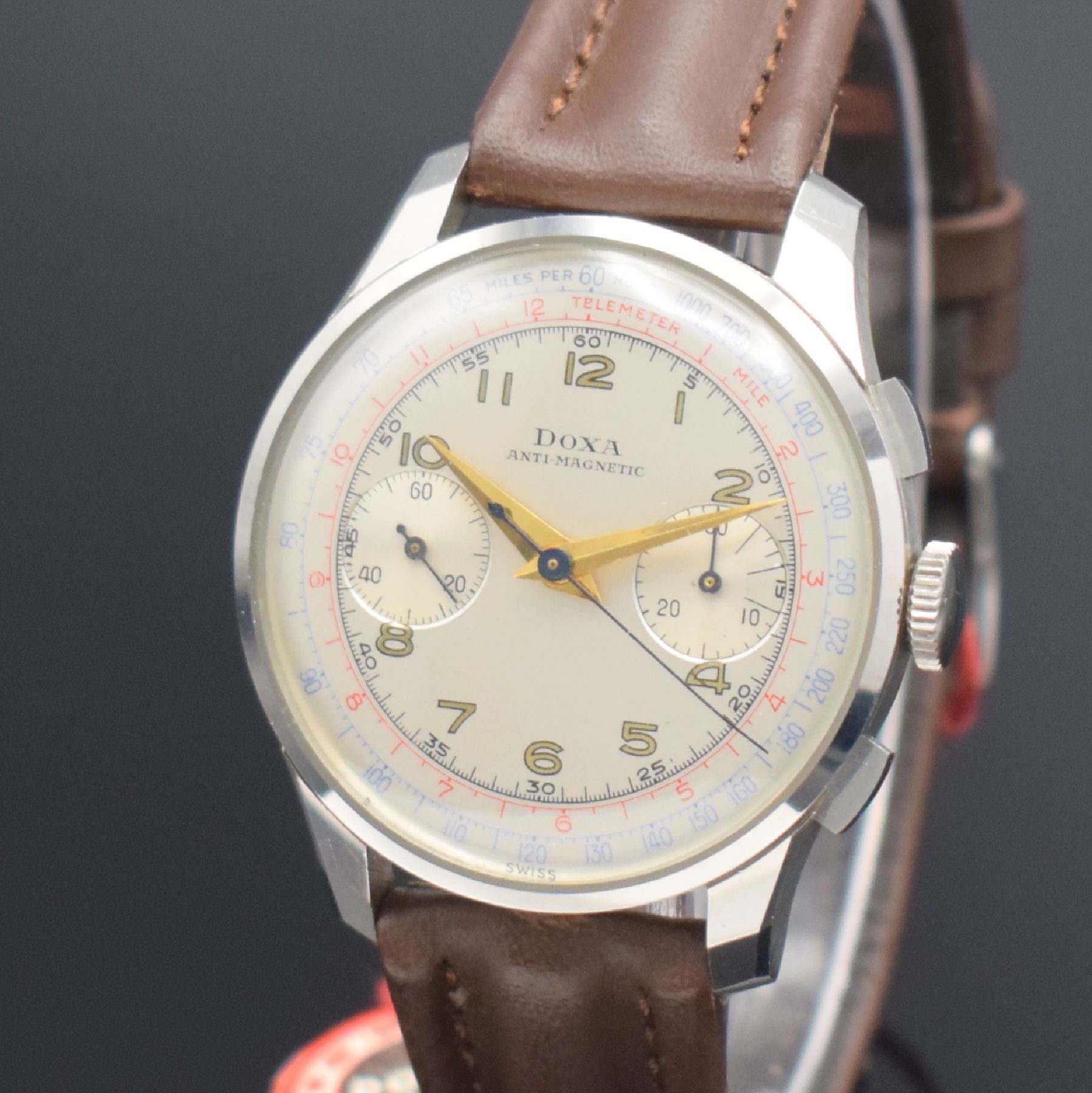 Detail c: DOXA nahezu neuwertige Herrenarmbanduhr mit Schaltradchronograph in Stahl, Schweiz um 1950, Handaufzug, gedr. 3-tlg. Geh. noch mit Schutzlack auf dem ...