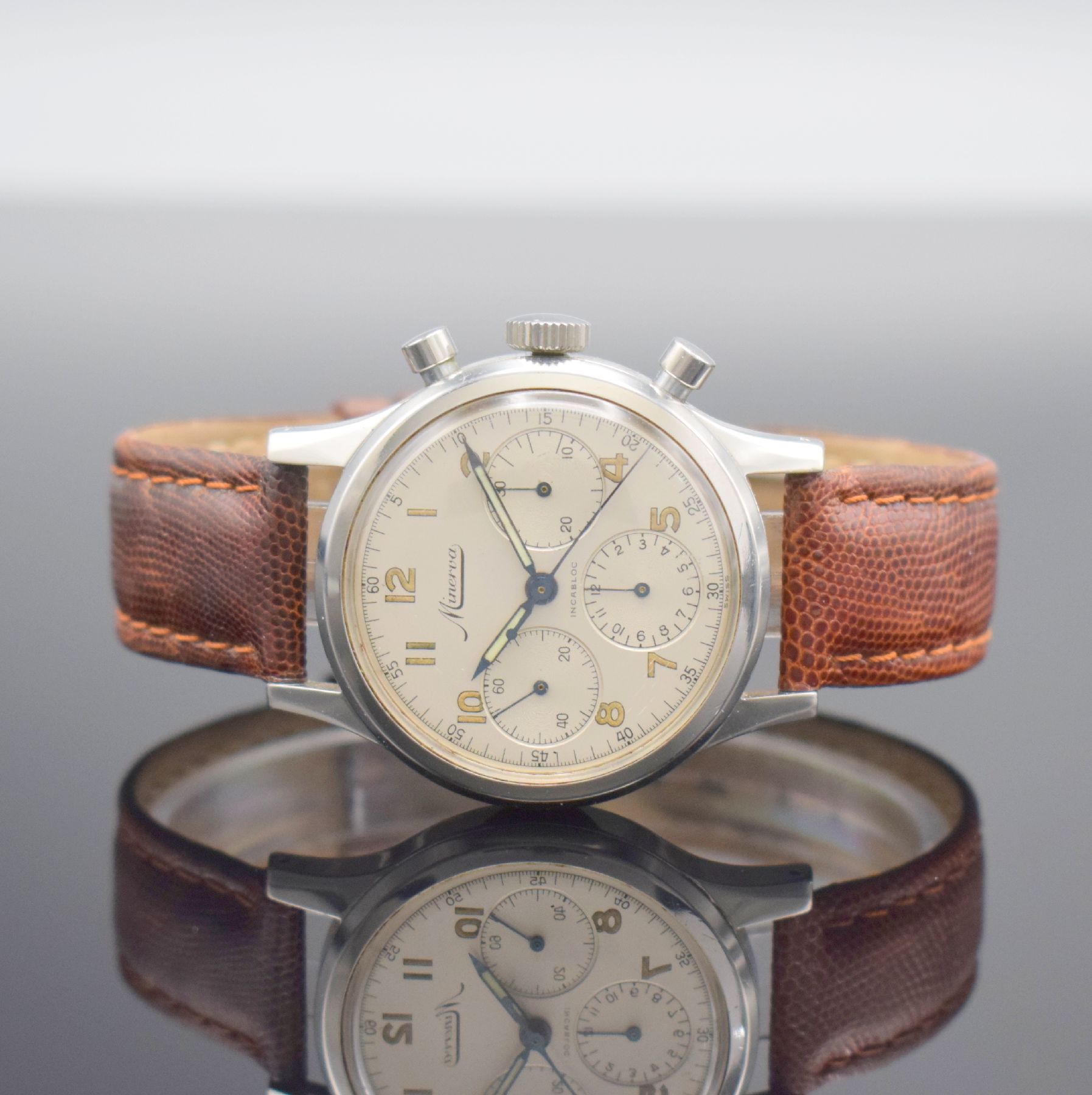 MINERVA Herrenarmbanduhr mit Chronograph Referenz VD 712 in Stahl, Schweiz um 1960, Handaufzug, Geh., Zifferbl. & Werk sign., Boden geschr., Glasrand ...