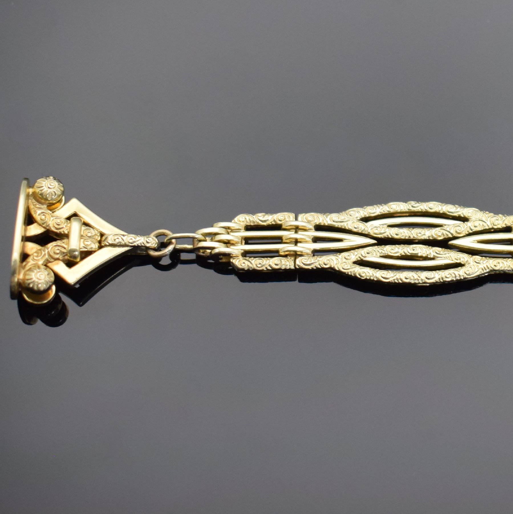 Detail c: 2 Taschenuhr-Chatelaines, 1x in GG 585/000 & 1x in Silber, um 1900 - 1920, 1) mit Karabiner & Anhänger m. Monogramm, aufw. graviert & dekoriert, L. ...