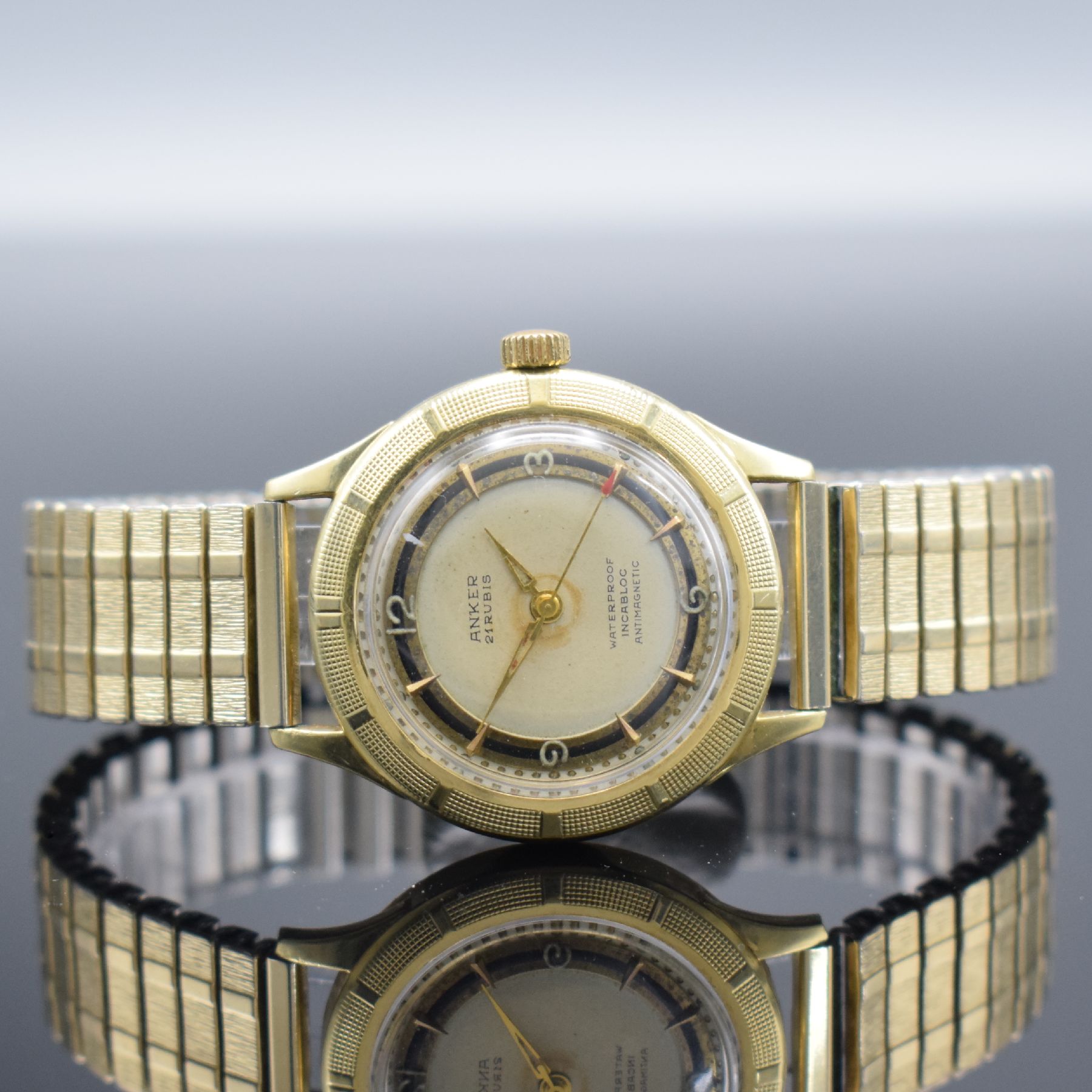 ANKER Armbanduhr in GG 585/000, Handaufzug, Deutschland um 1960, Boden verschr., Zifferbl. altersbed. fl./pat. "Tropical", Anz. v. ...