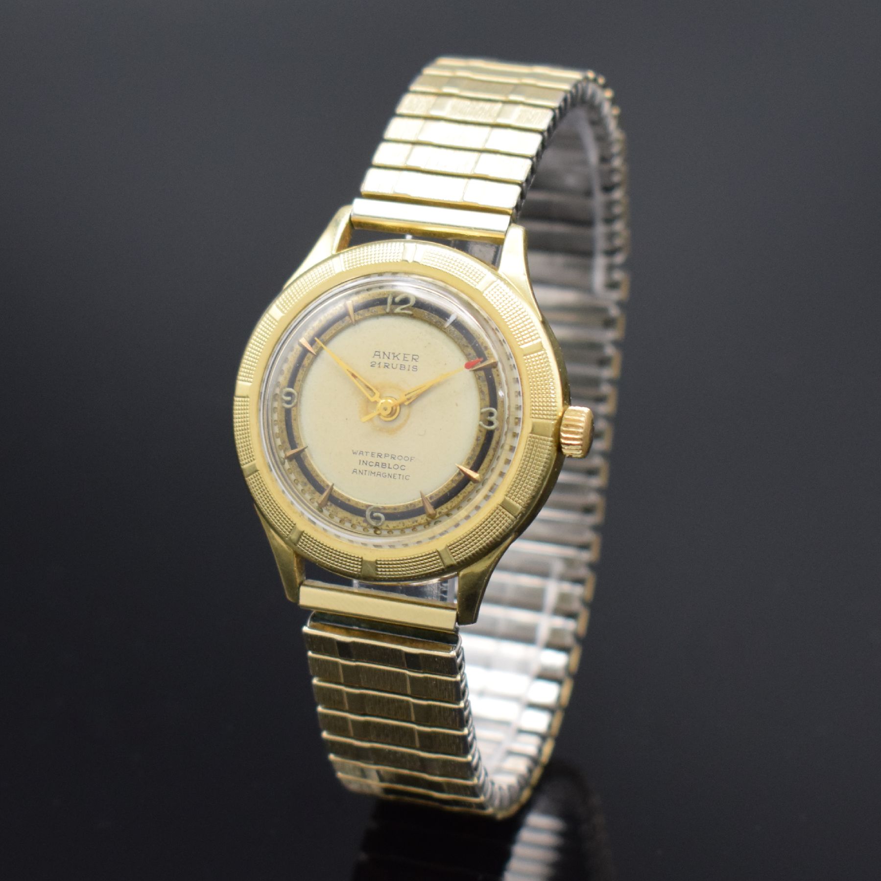 Detail b: ANKER Armbanduhr in GG 585/000, Handaufzug, Deutschland um 1960, Boden verschr., Zifferbl. altersbed. fl./pat. "Tropical", Anz. v. ...