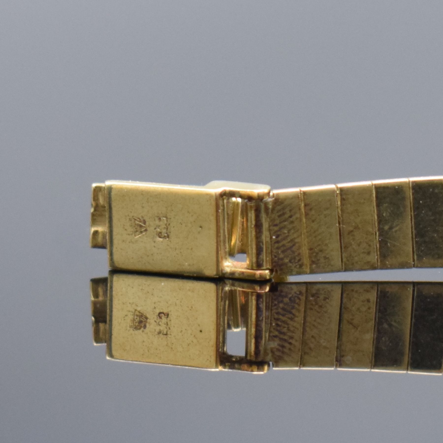 Detail d: ELEGANCE Damenarmbanduhr in GG 585/000 mit Goldband in 585/000, Schweiz um 1960, Handaufzug, 2-teil. Geh., Boden aufgedr., Goldband m. Klappschl., ...