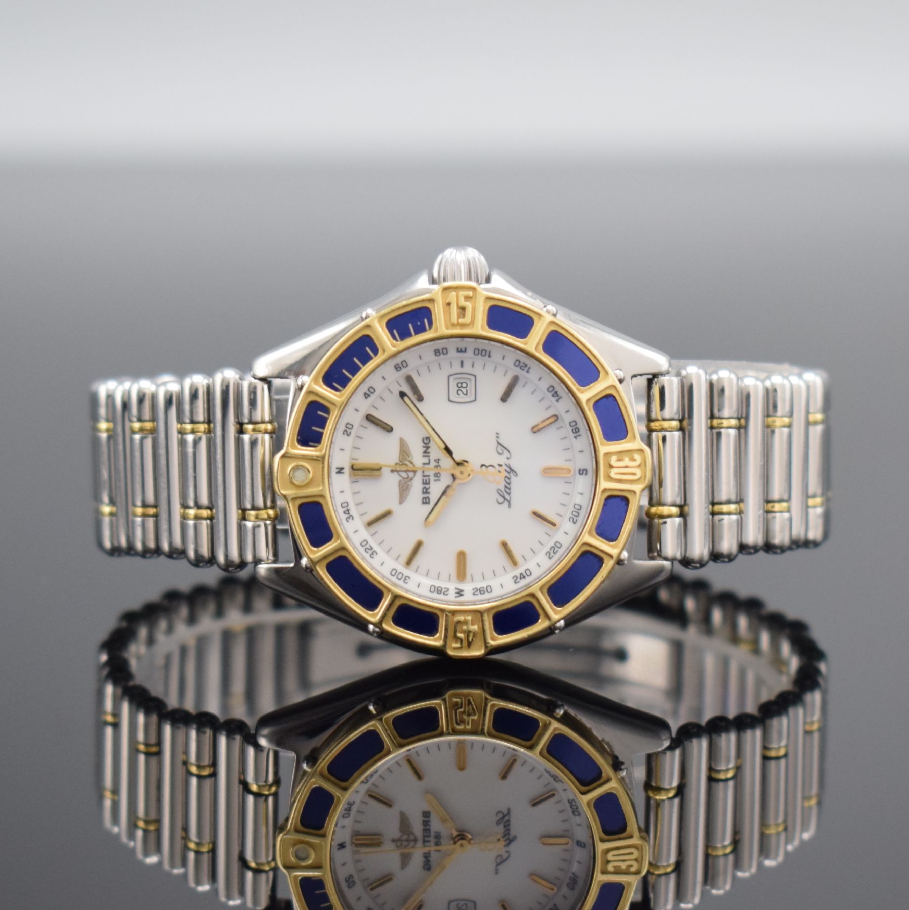 BREITLING Lady J Damenarmbanduhr Referenz D52065, Schweiz um 1995, quarz, verschr. Edelstahlgeh. inkl. orig. Gliederband m. Faltschl., GG-Lünette ...