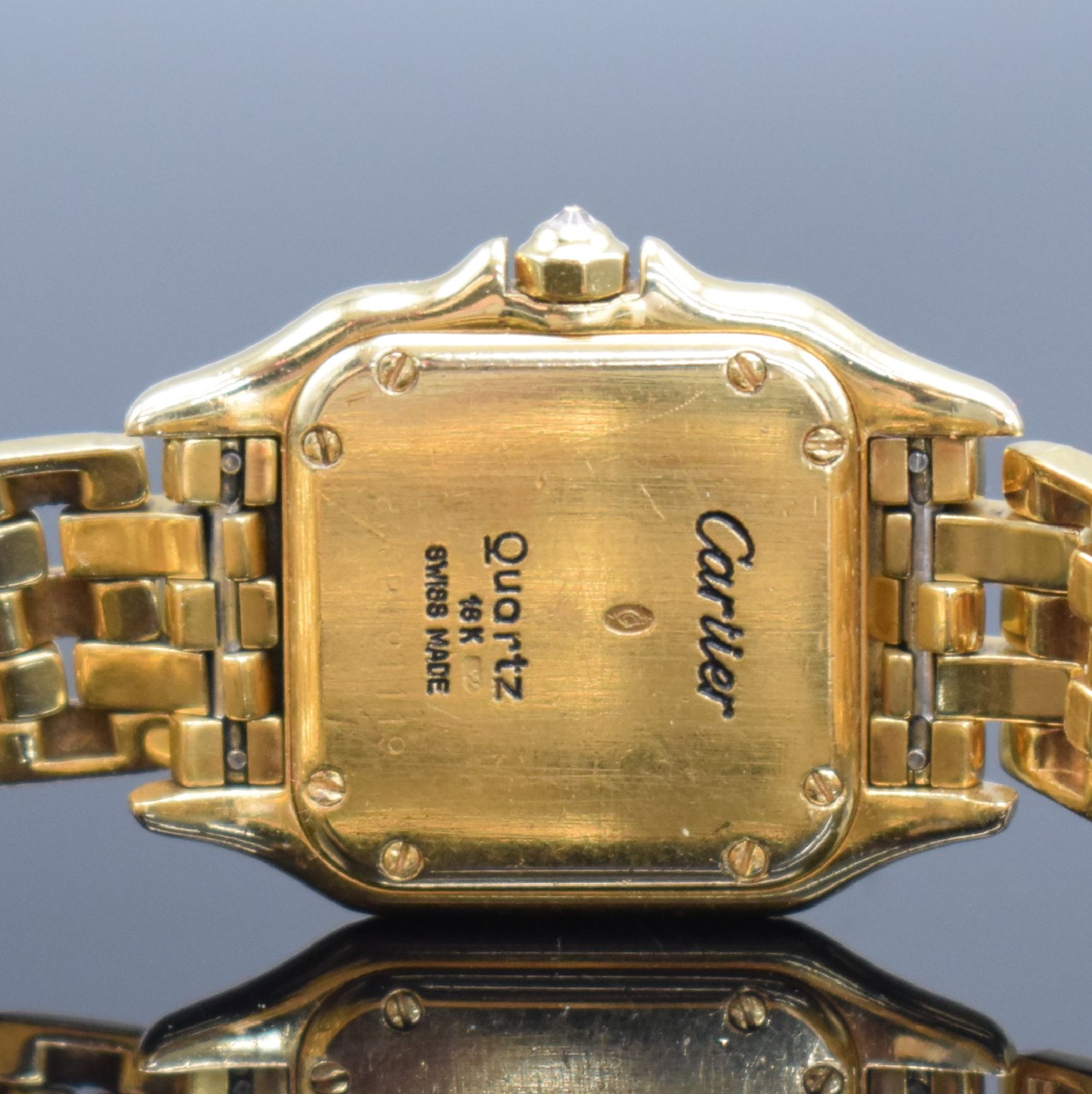 Detail e: CARTIER Damenarmbanduhr Panthére in GG 750/000, Schweiz um 1985, massiv. Goldgeh. inkl. Gliederband mit dopp. Faltschl., Boden 8-fach verschr., ...