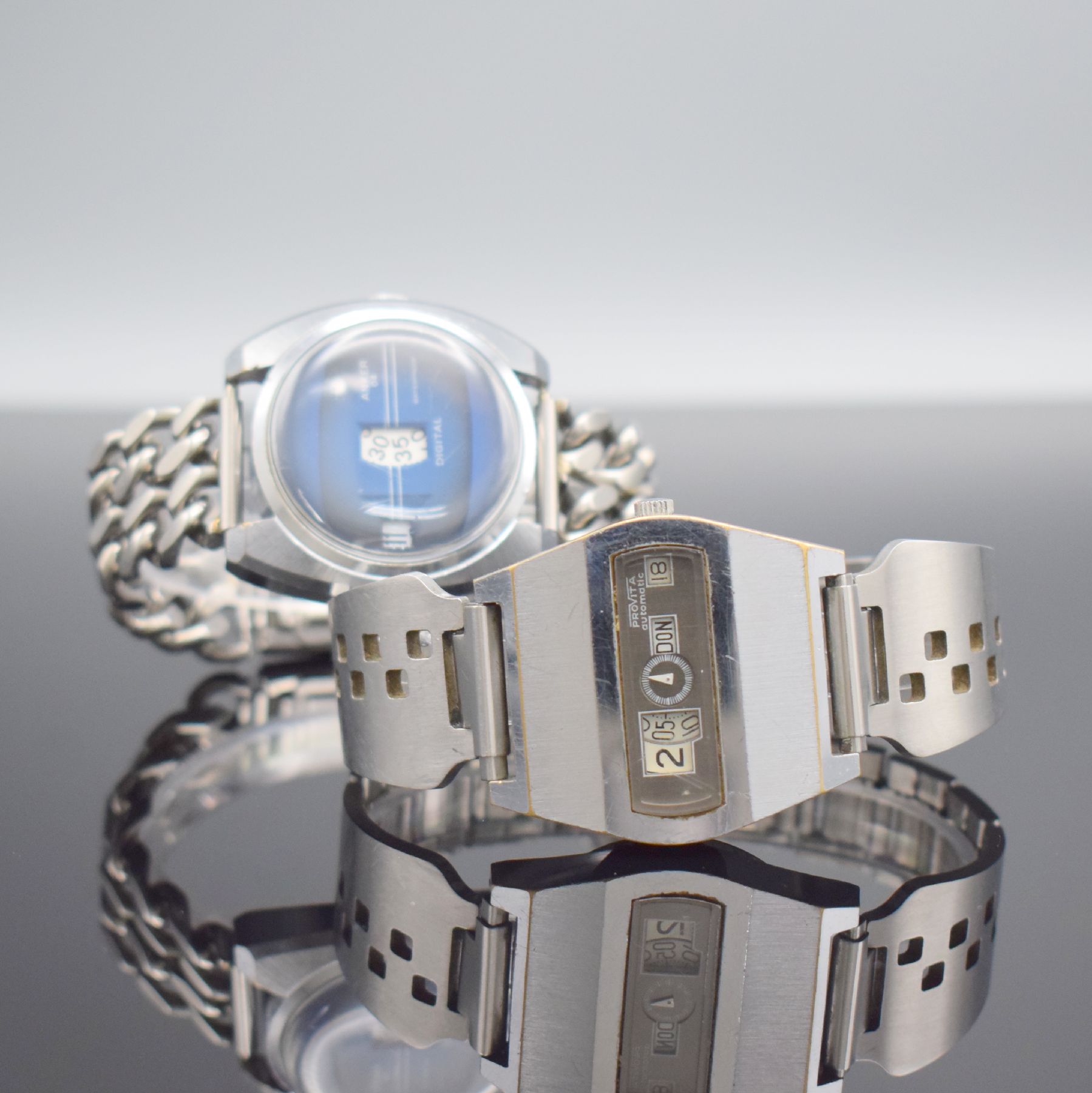 ANKER & PROVITA 2 Herrenarmbanduhren mit digitaler Anzeige, 1.) ANKER Deutschland um 1970, Handaufzug, verchr. Geh., Stahlboden geschr., neutr. ...