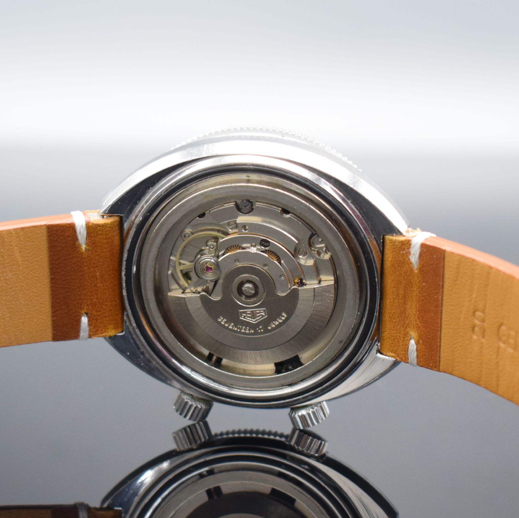 Detail d: HEUER seltene Herrenarmbanduhr mit Tidenanzeige Modell SOLUNAR Referenz 279.603, Schweiz um 1977, Automatik, Edelstahlgeh., Boden geschr., Lünette ...